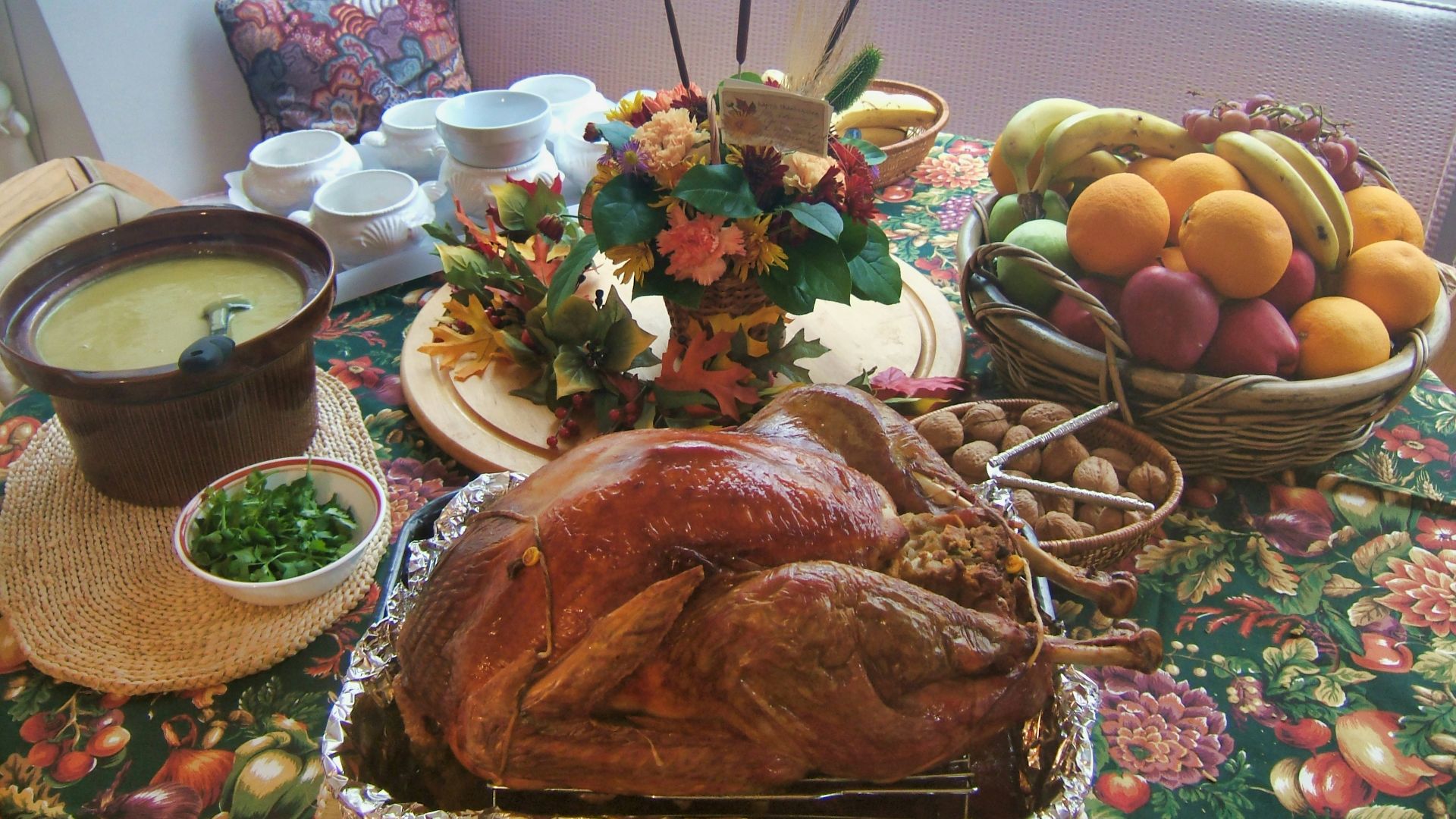 roasted chicken beside basket of fruits