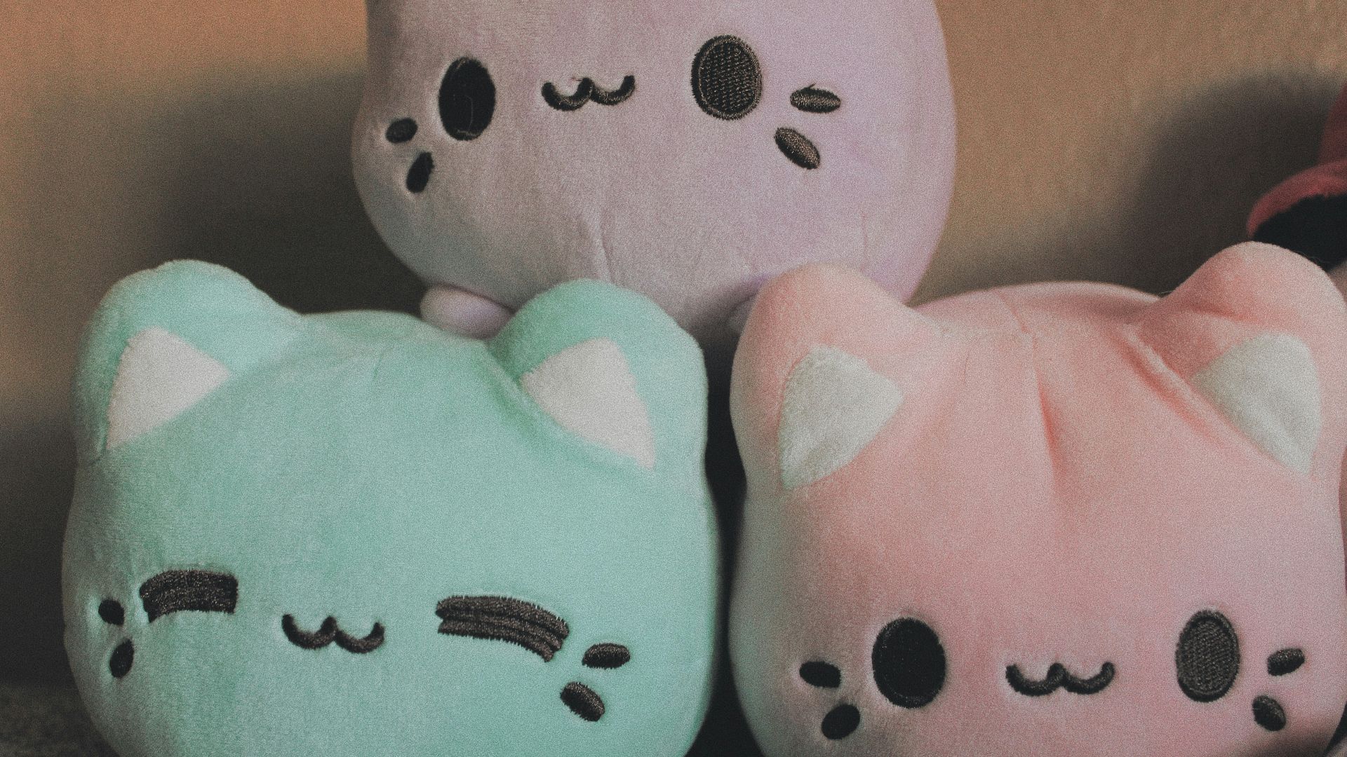 a couple of stuffed animals sitting next to each other