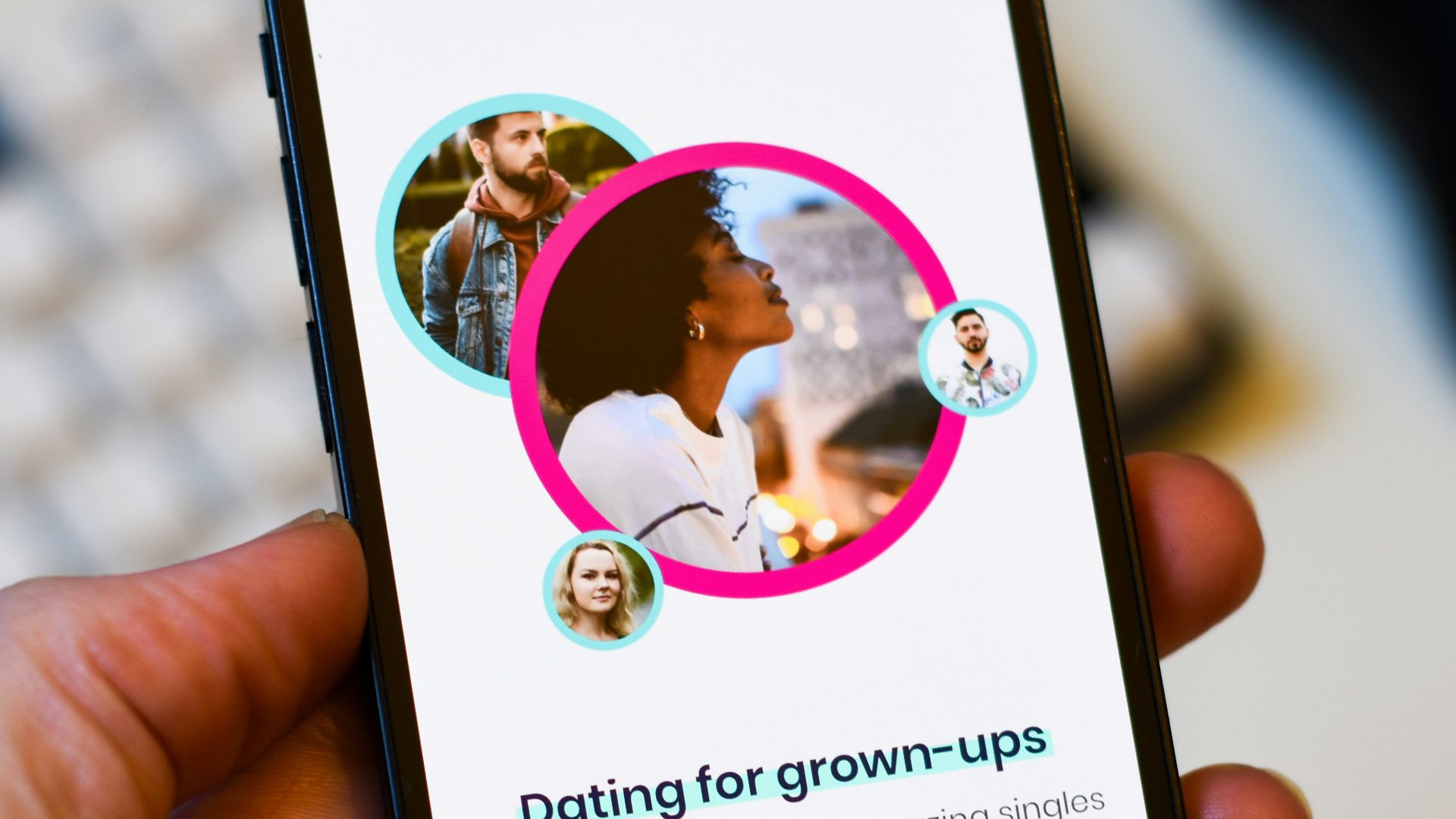 a person holding a cell phone in their hand