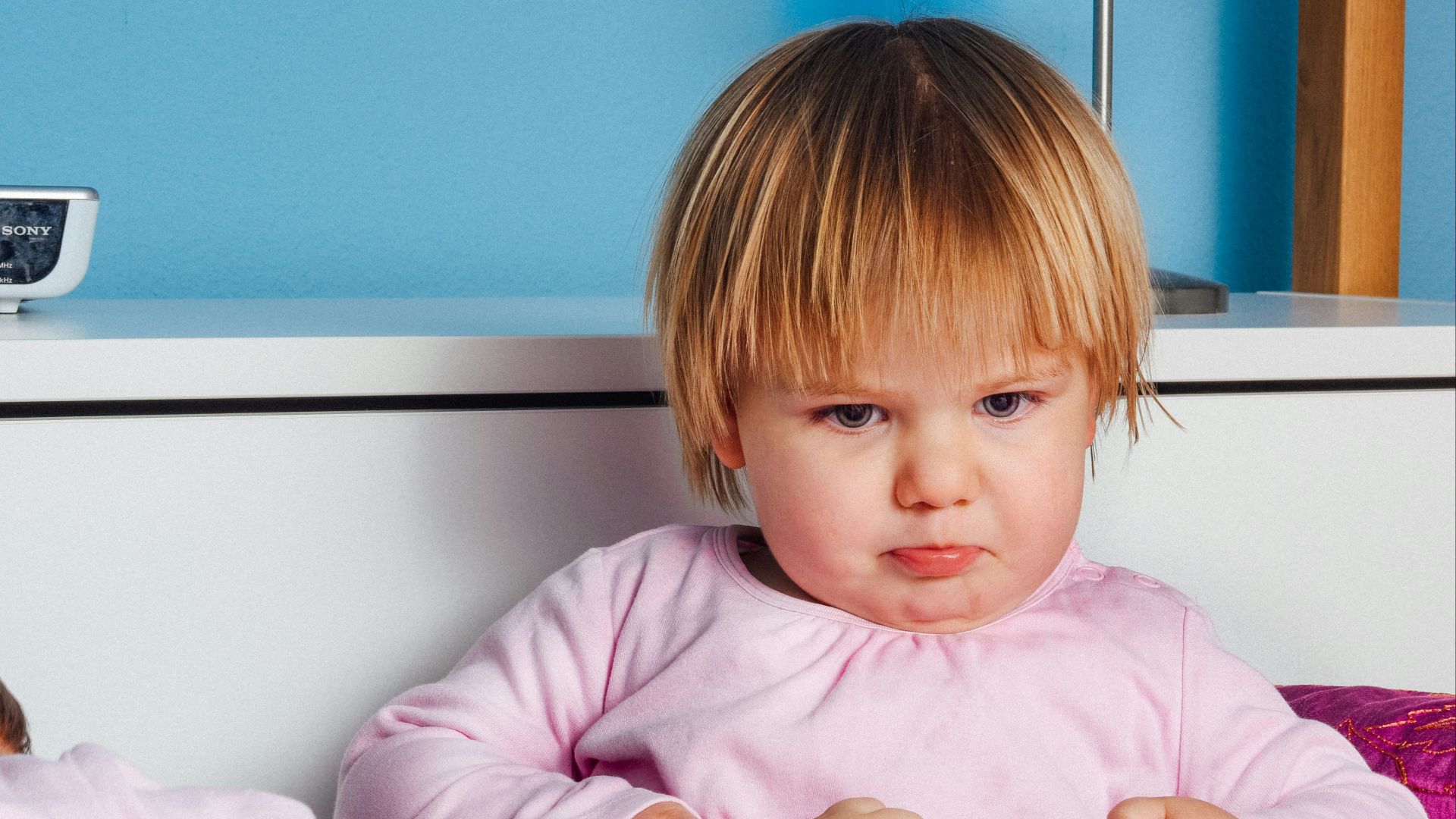 boy wearing pink long-sleeved top
