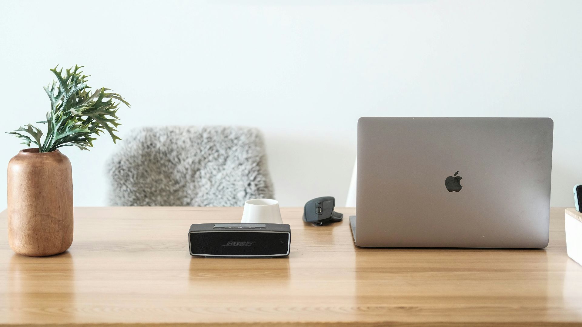macbook pro on brown wooden table