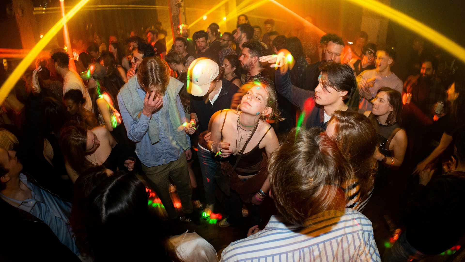 a group of people dancing at a party