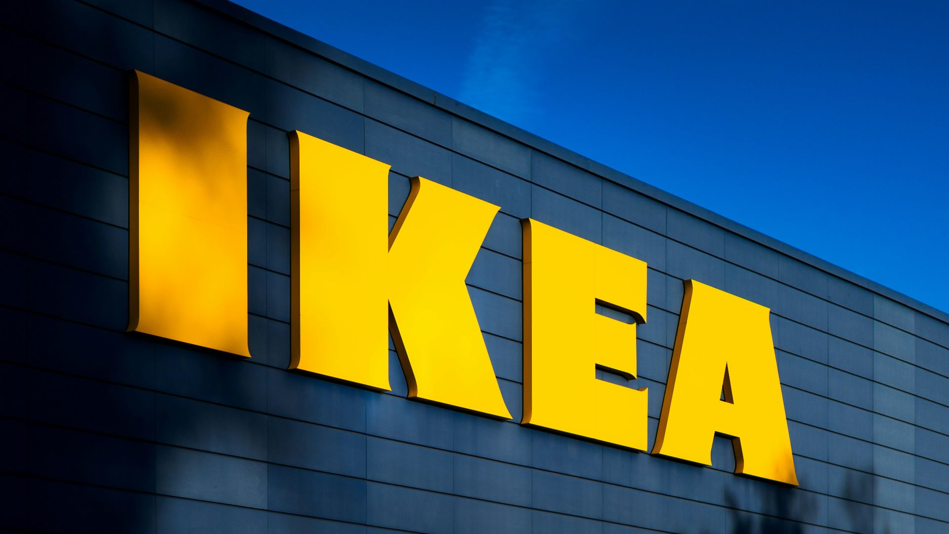 a yellow ikea sign on the side of a building