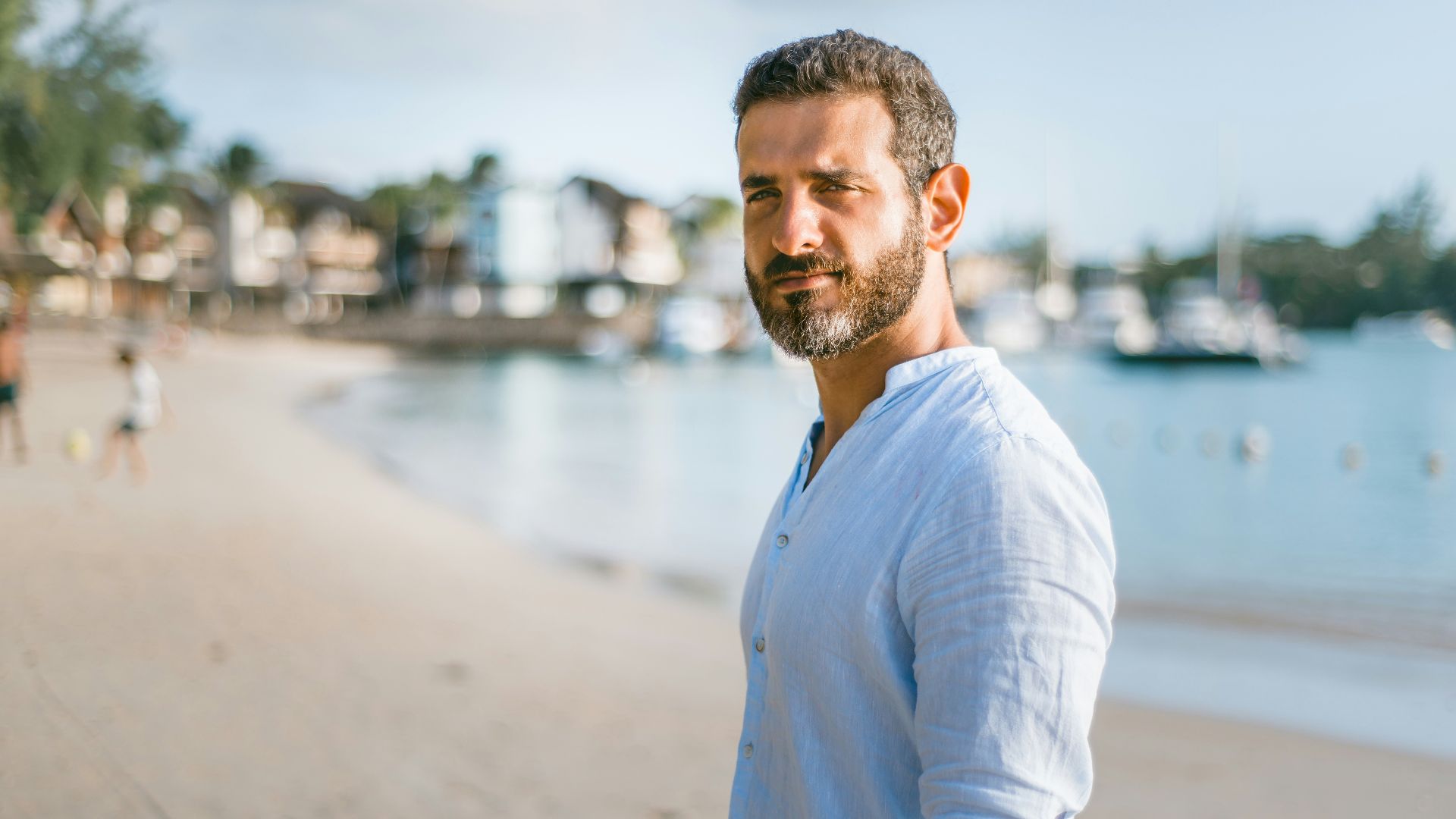 man standing on beach during daytime