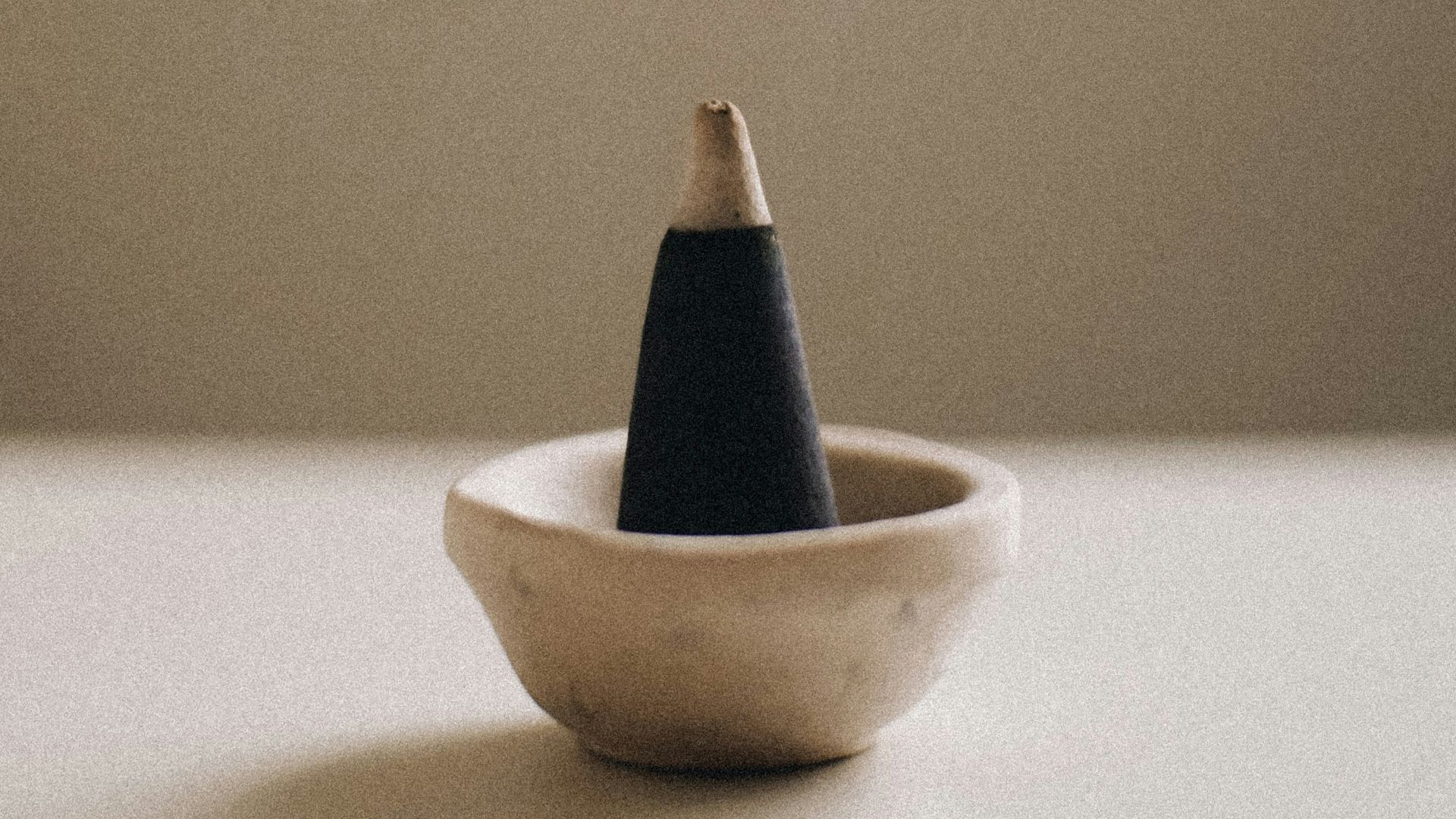 a smokestack sitting in a bowl on a table