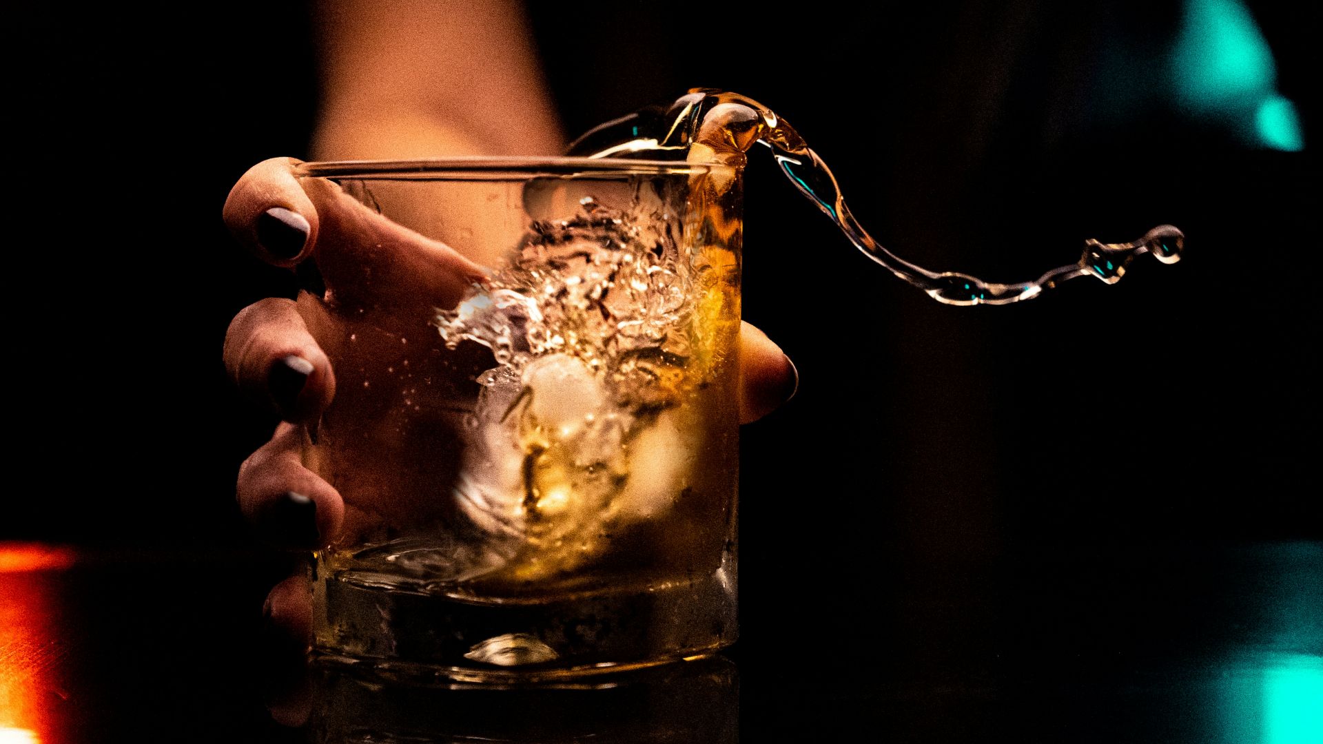 clear drinking glass with ice cubes