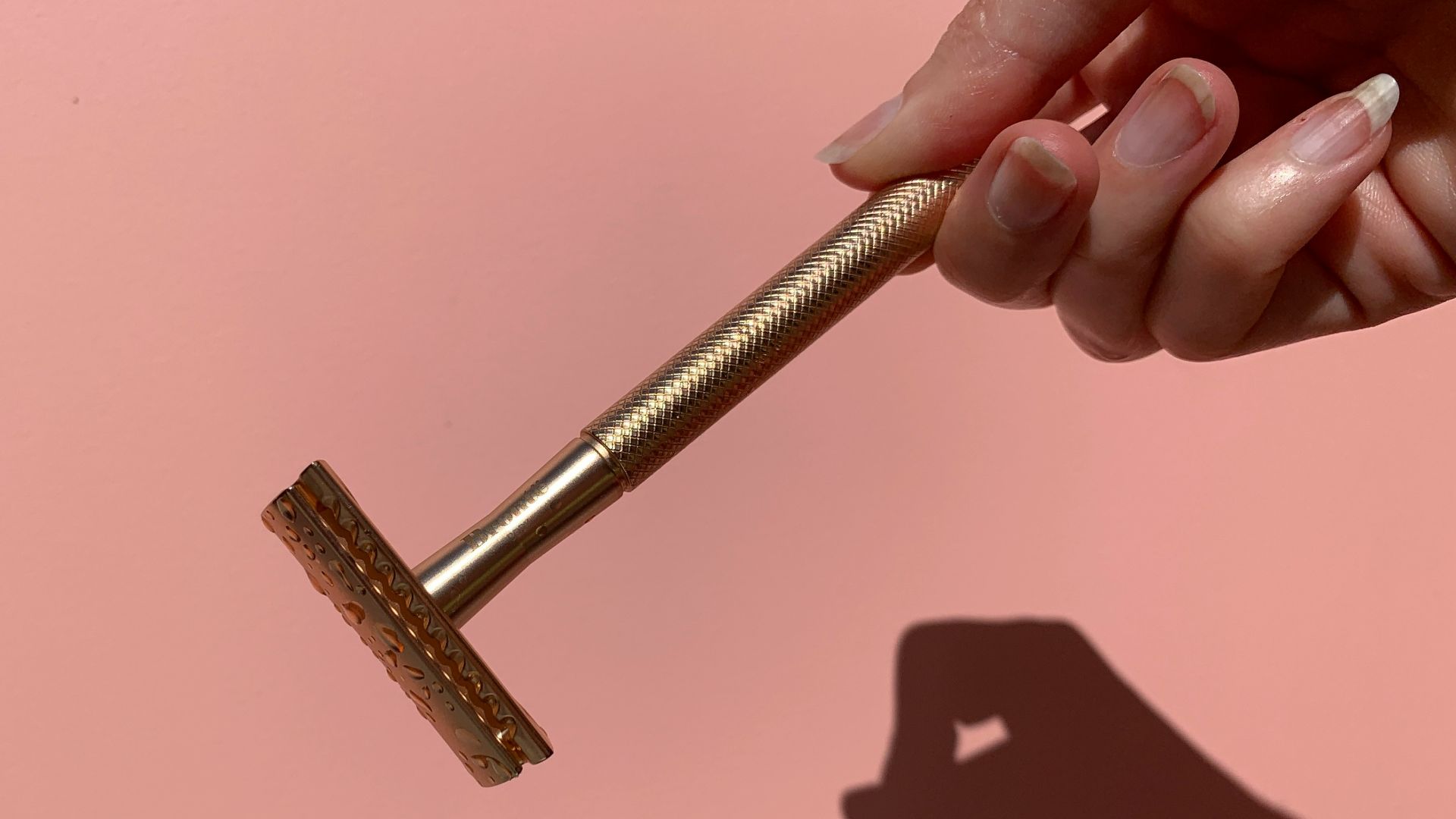 person holding gray metal tool