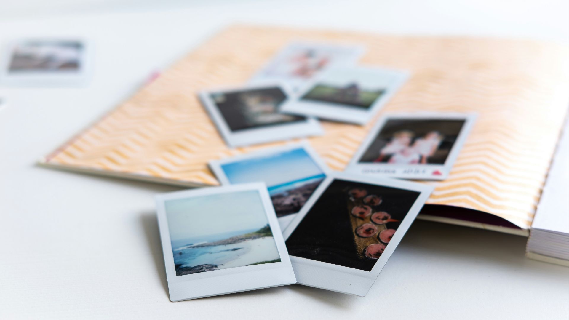 photos on white wooden table