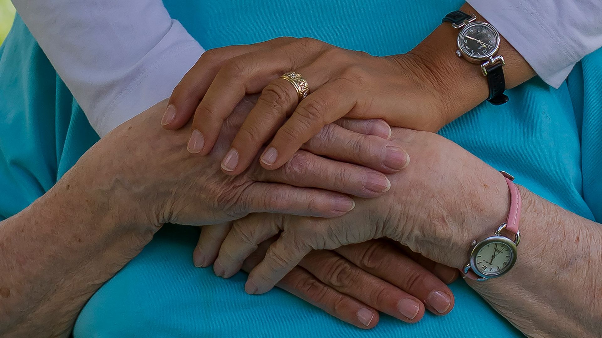 person wearing silver round analog watch