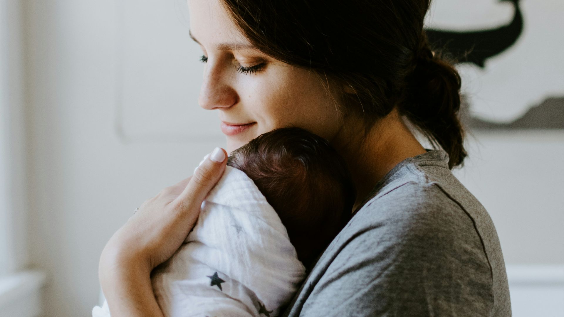 mother carrying baby