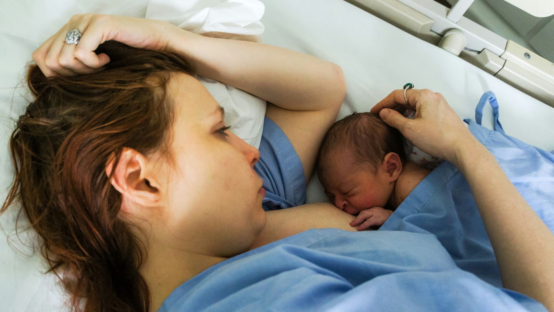 woman breastfeed the baby