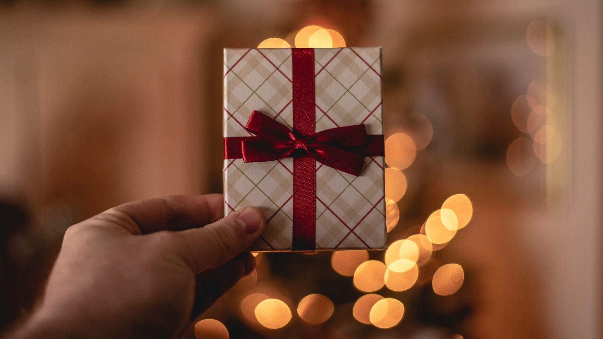 person holding white gift card