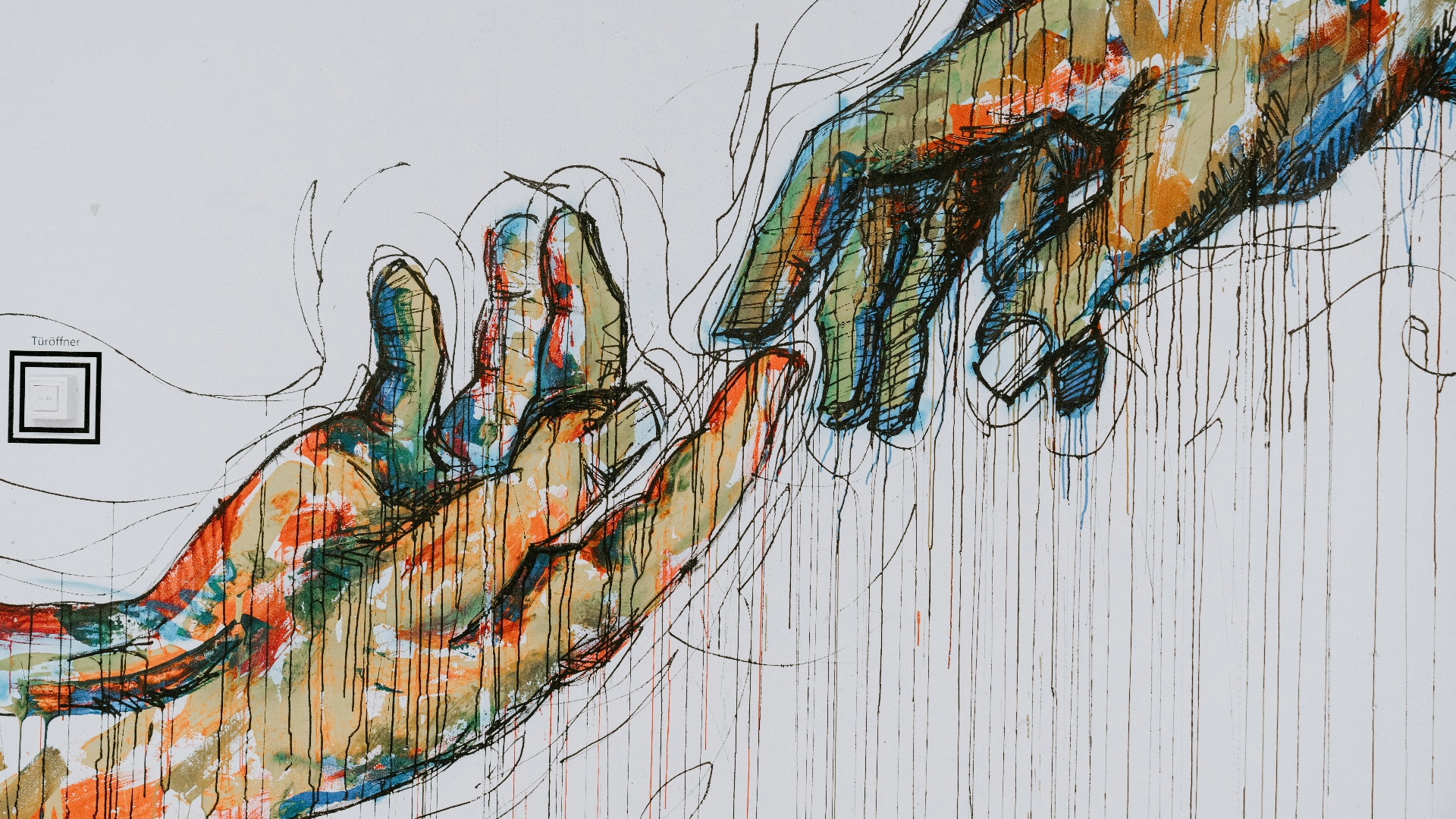 two human hands painting