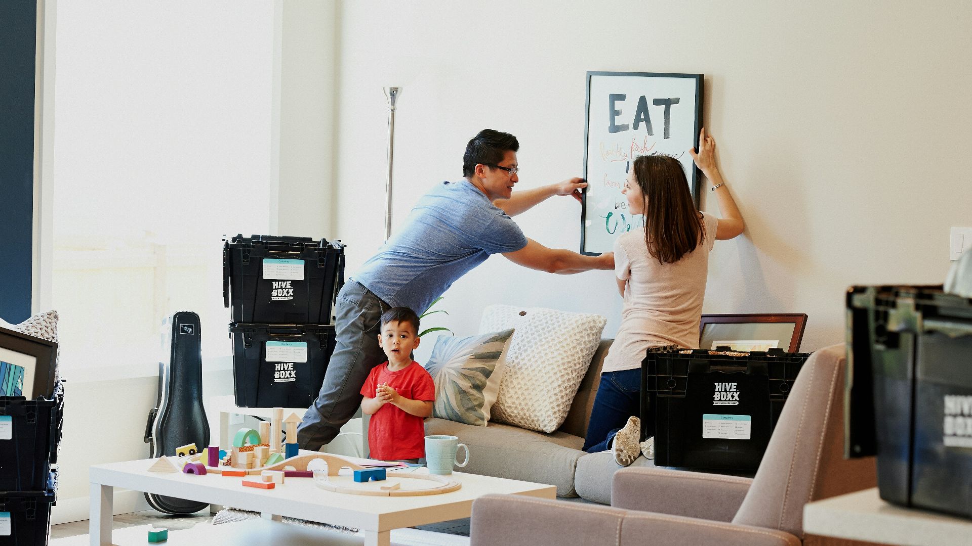 woman in blue denim jacket standing beside woman in black shirt