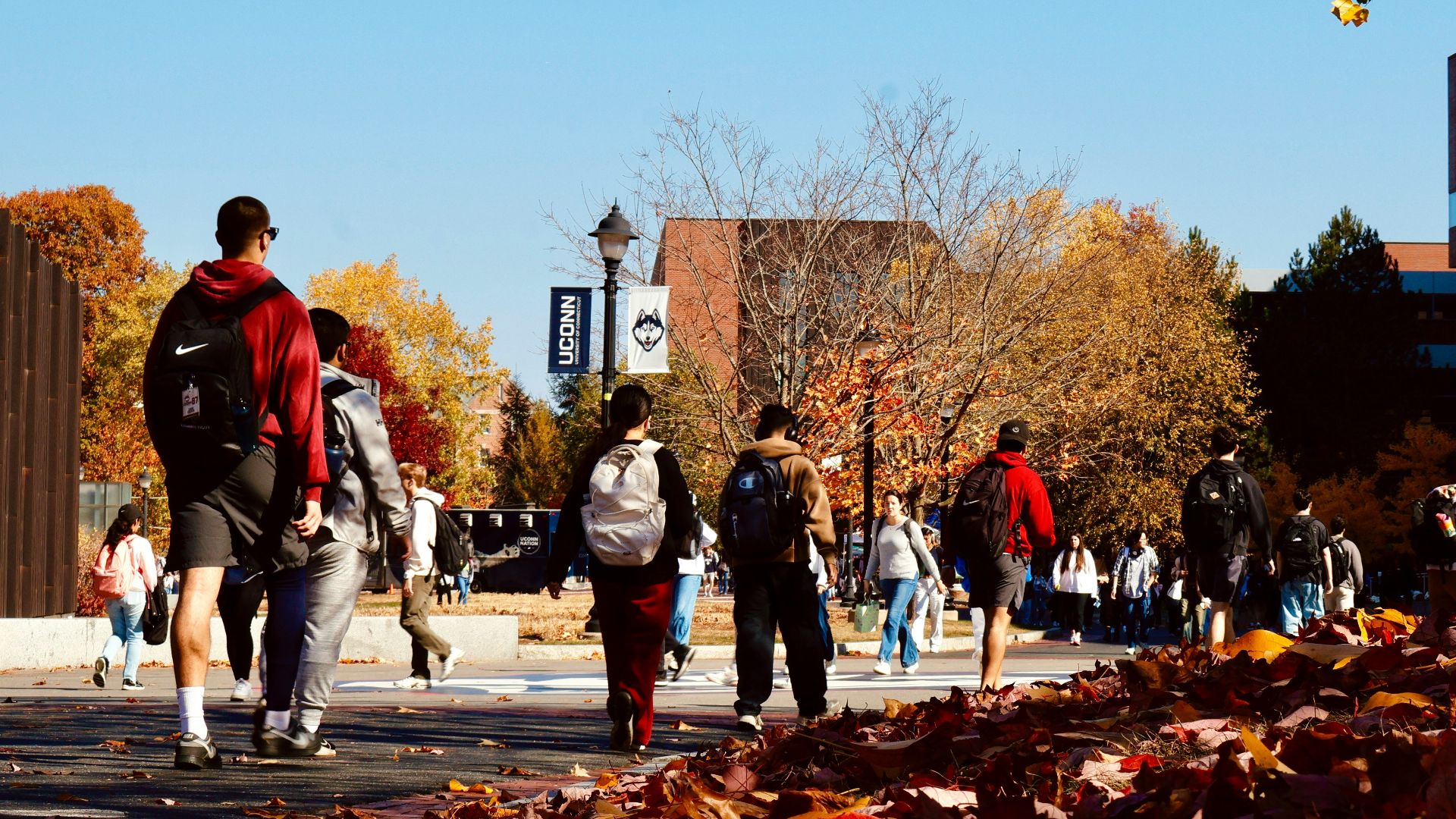 A group of people walking down a street