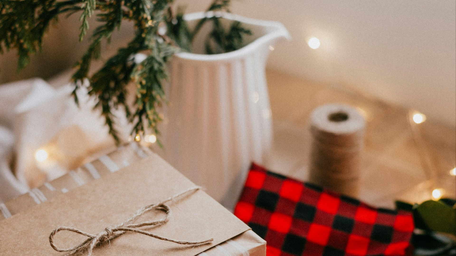 brown and white gift box on red and white checkered textile