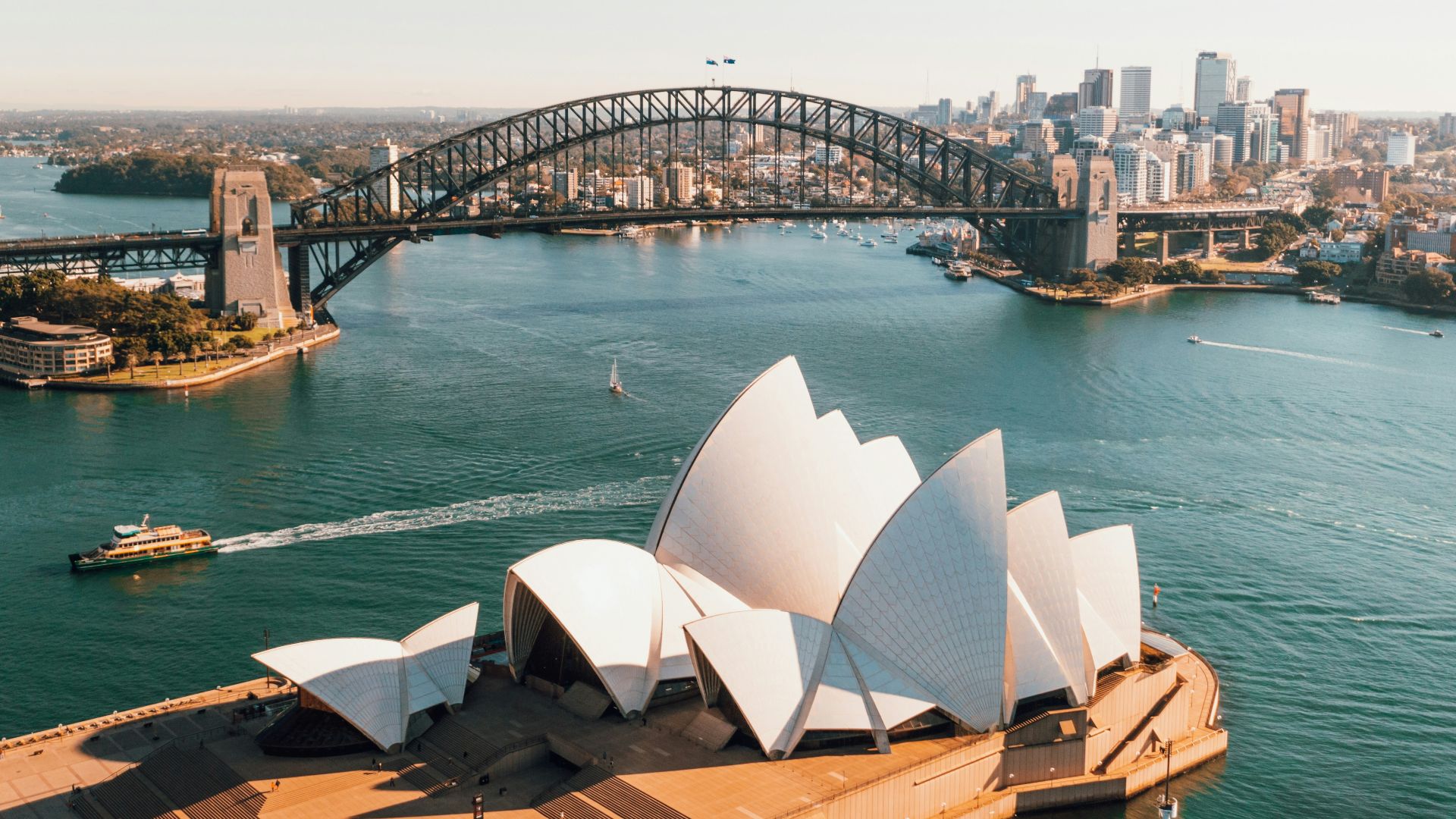 sydney opera house near body of water during daytime