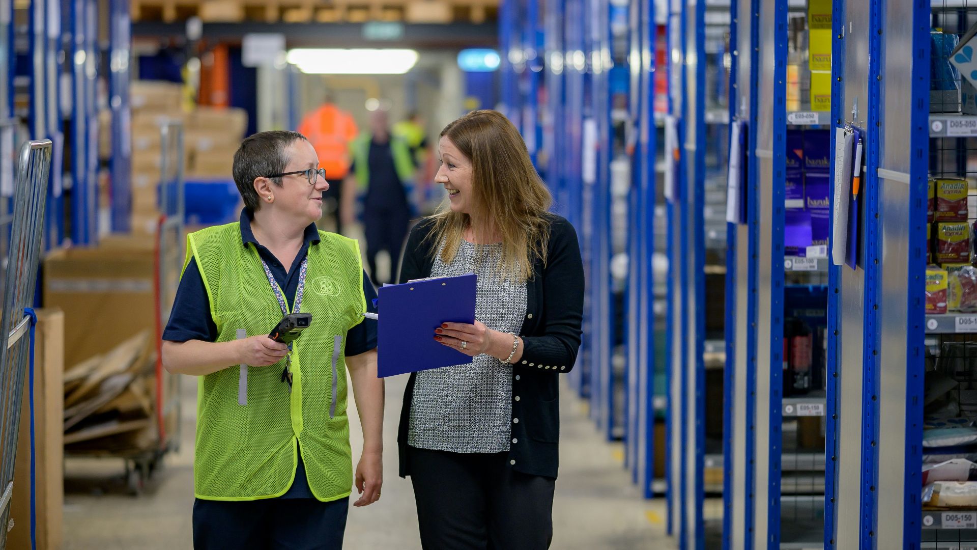 a man and a woman in a warehouse