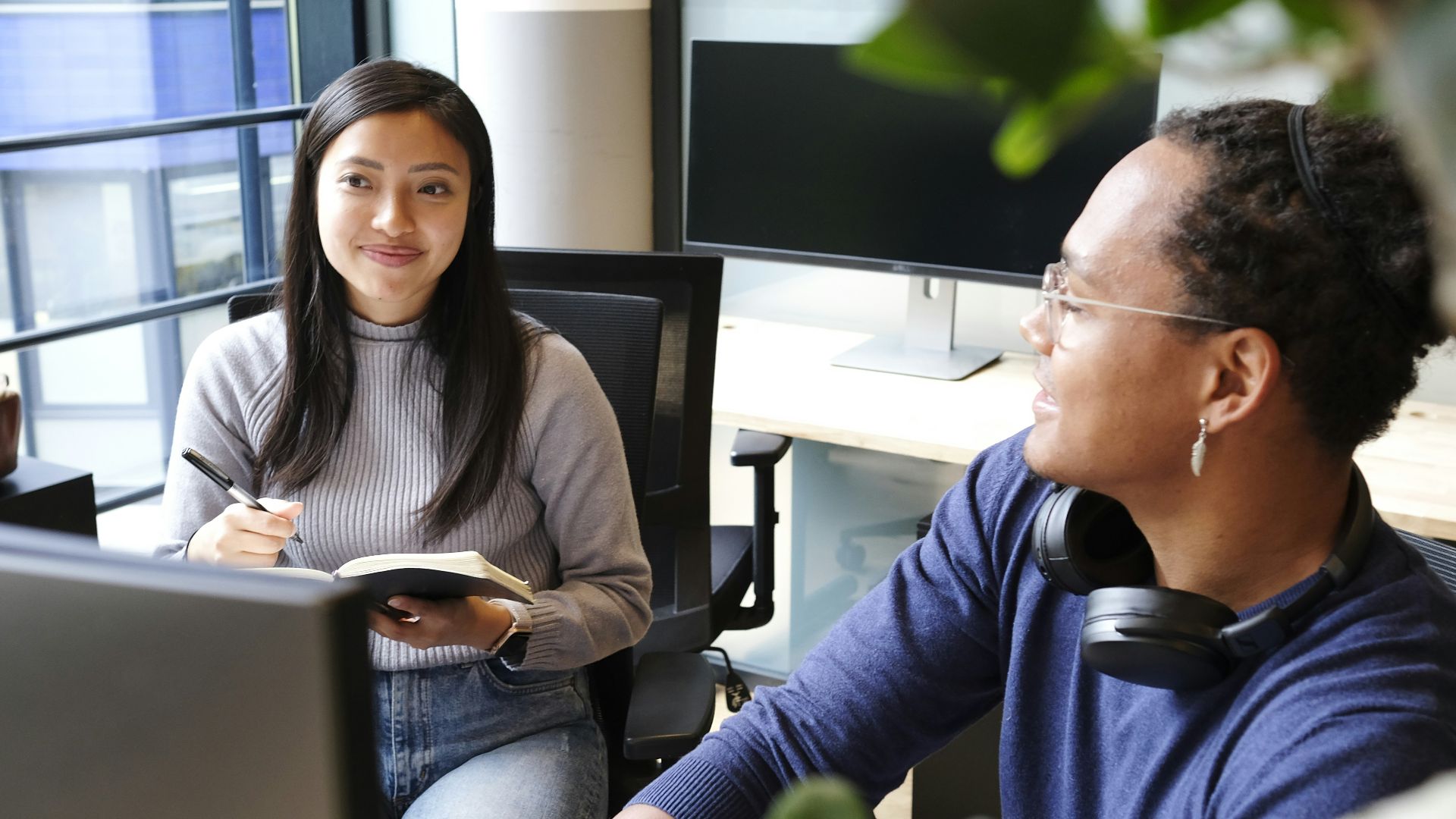 man and woman sitting on chair
