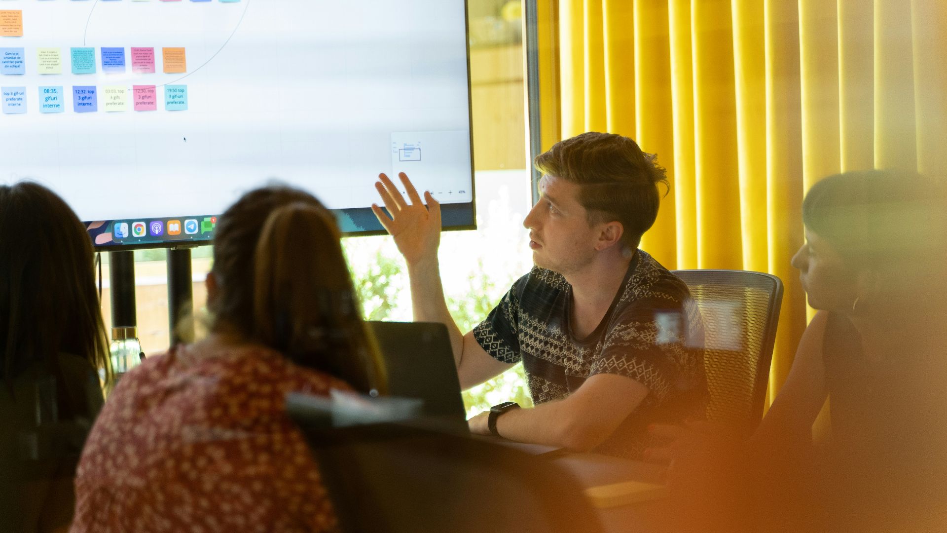 a man giving a presentation to a group of people