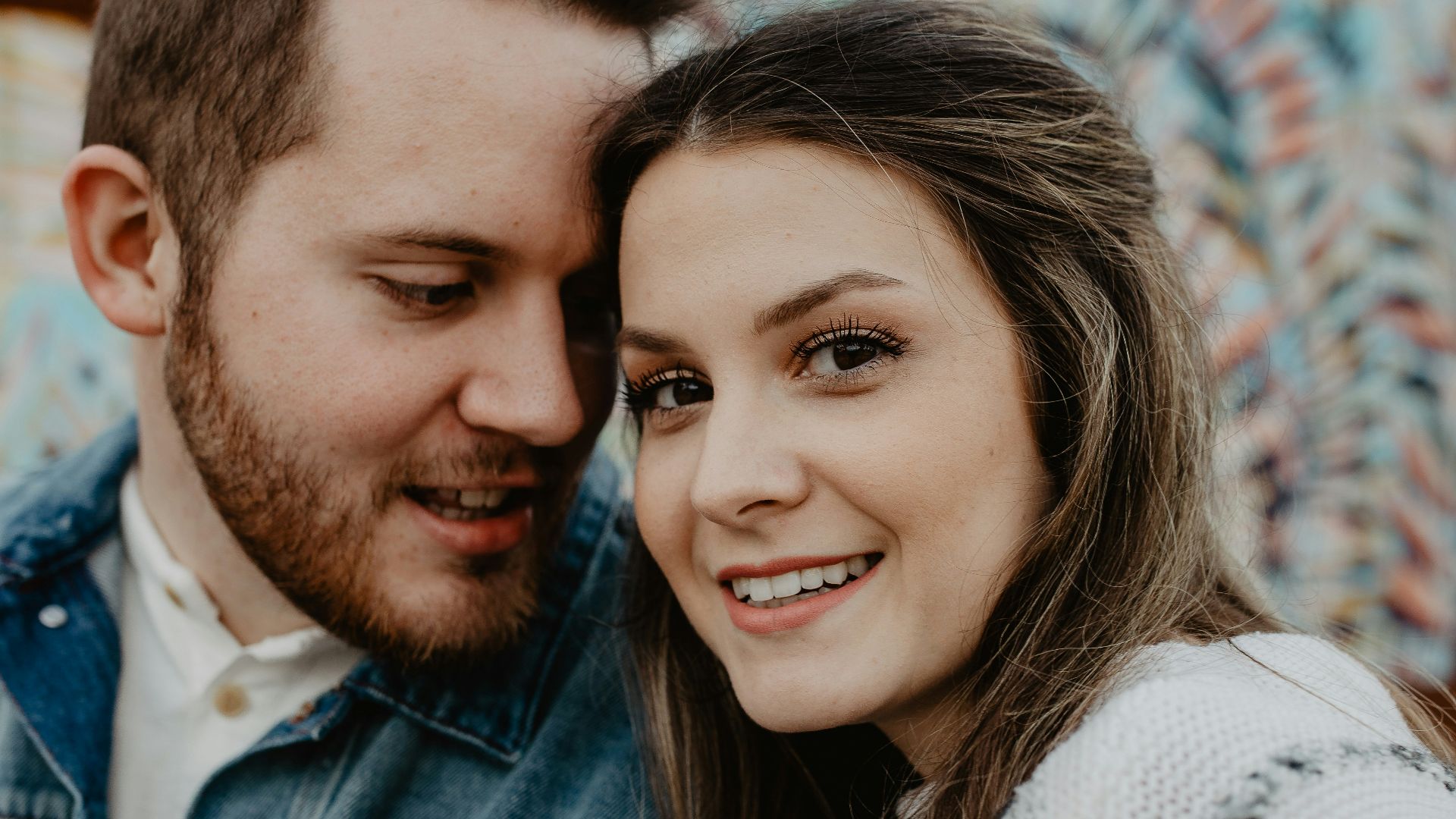 woman and man wearing white sweater