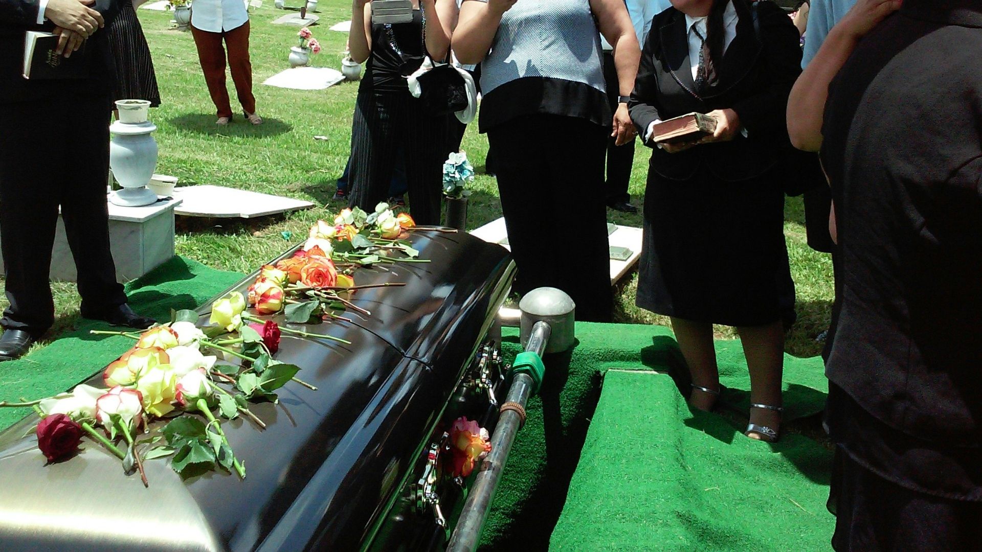 group of people attending burial