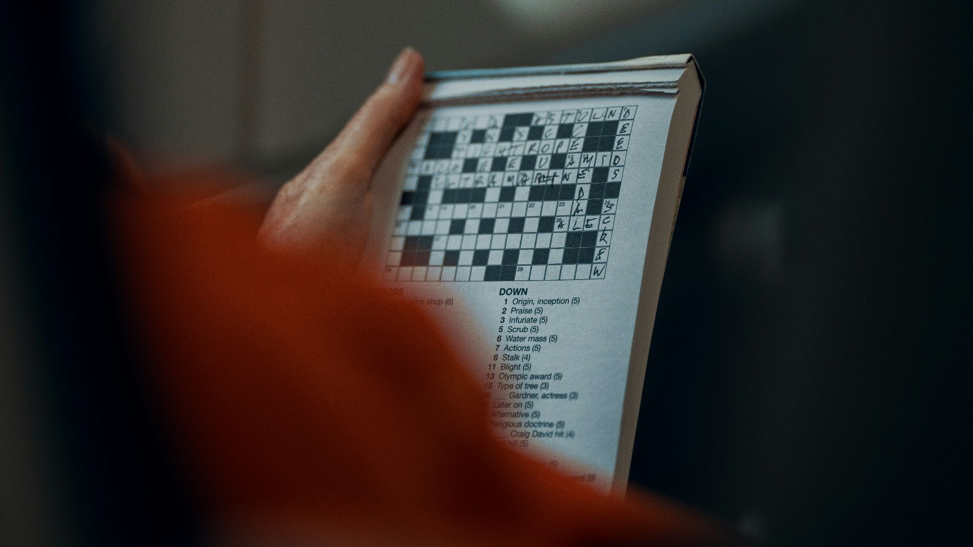 person holding white and black paper