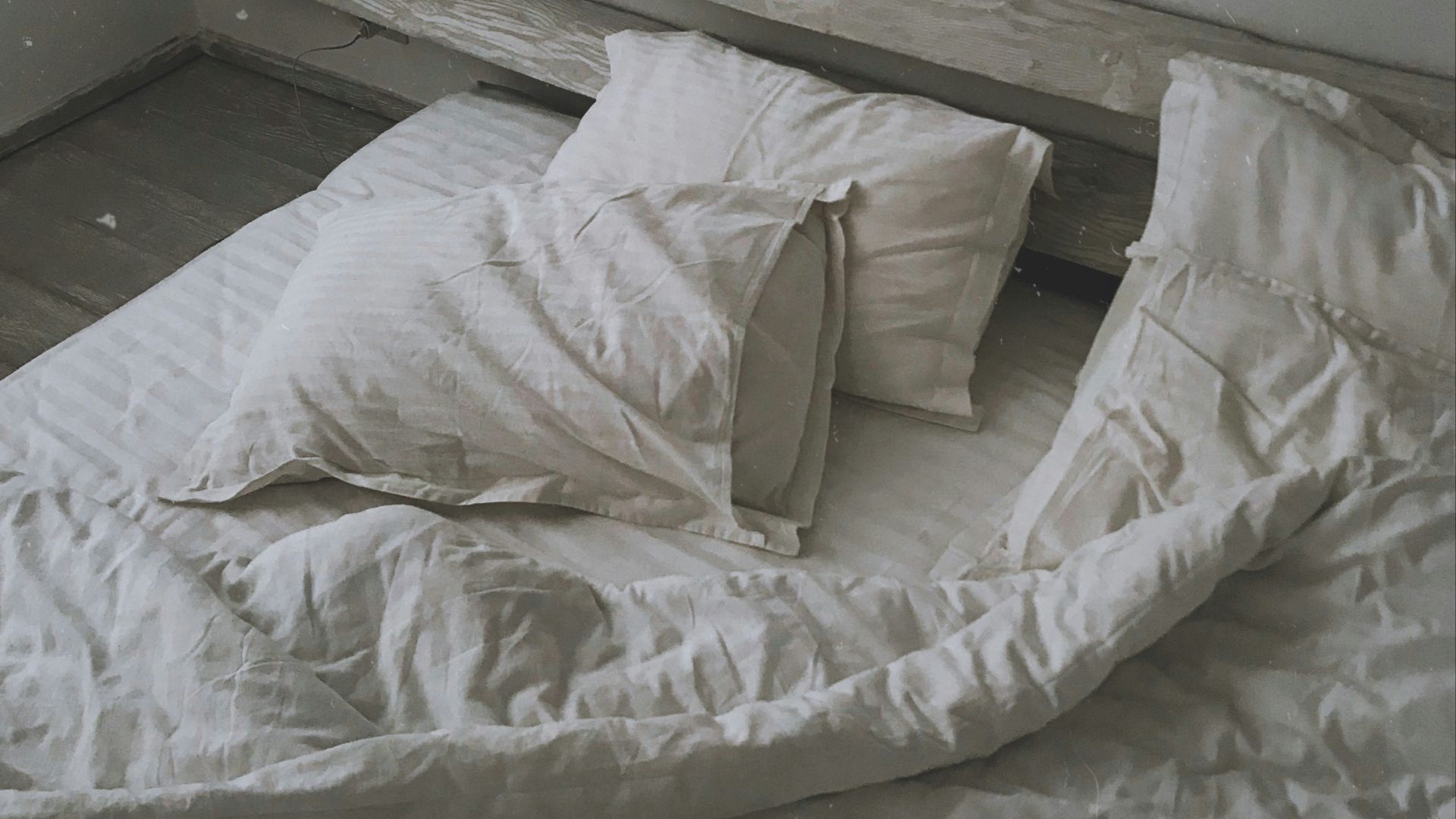 white pillows and blanket on bed