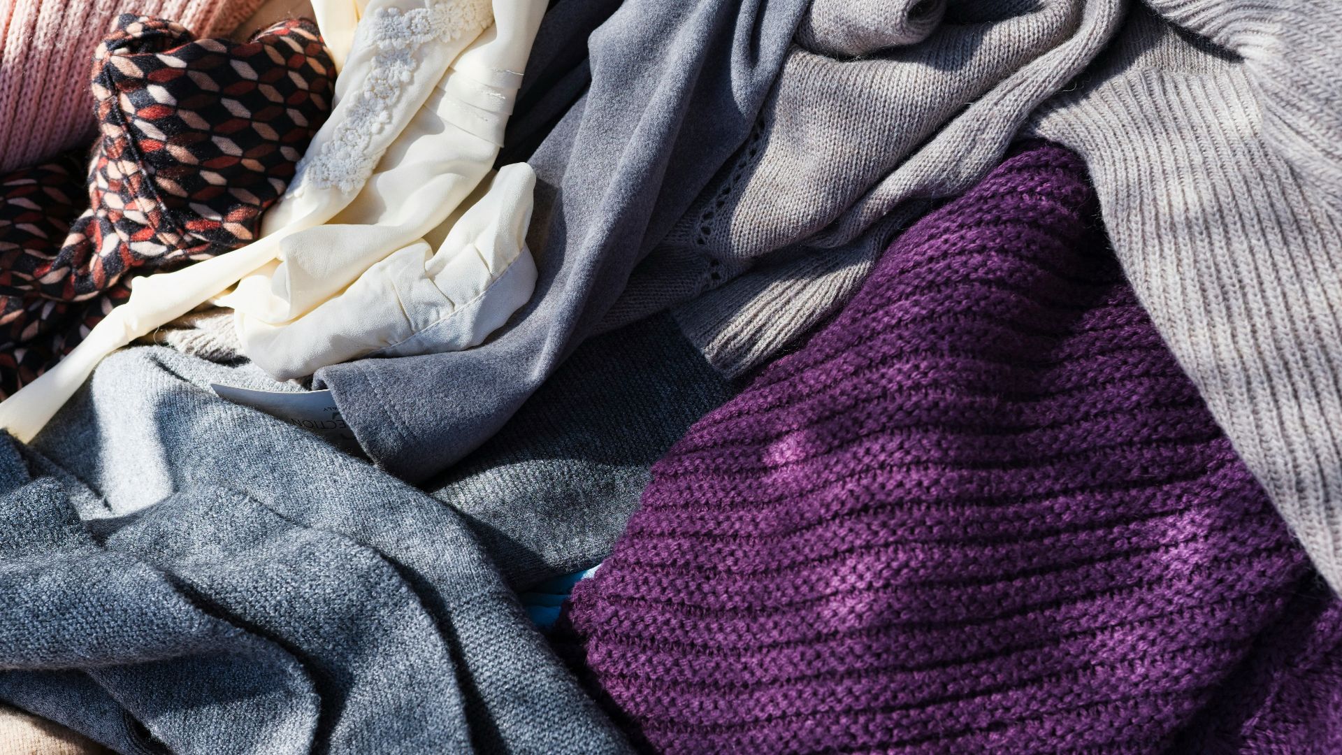 a pile of purple and white cloth