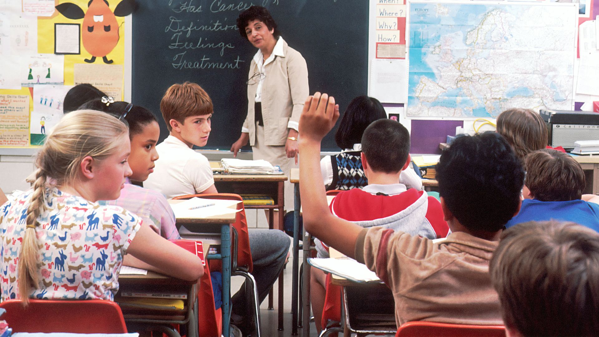 woman standing in front of children