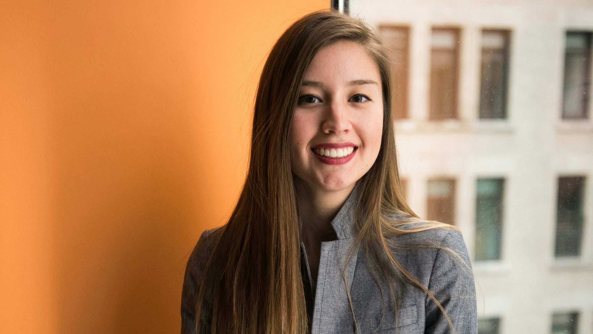 shallow focus photo of woman in gray jacket