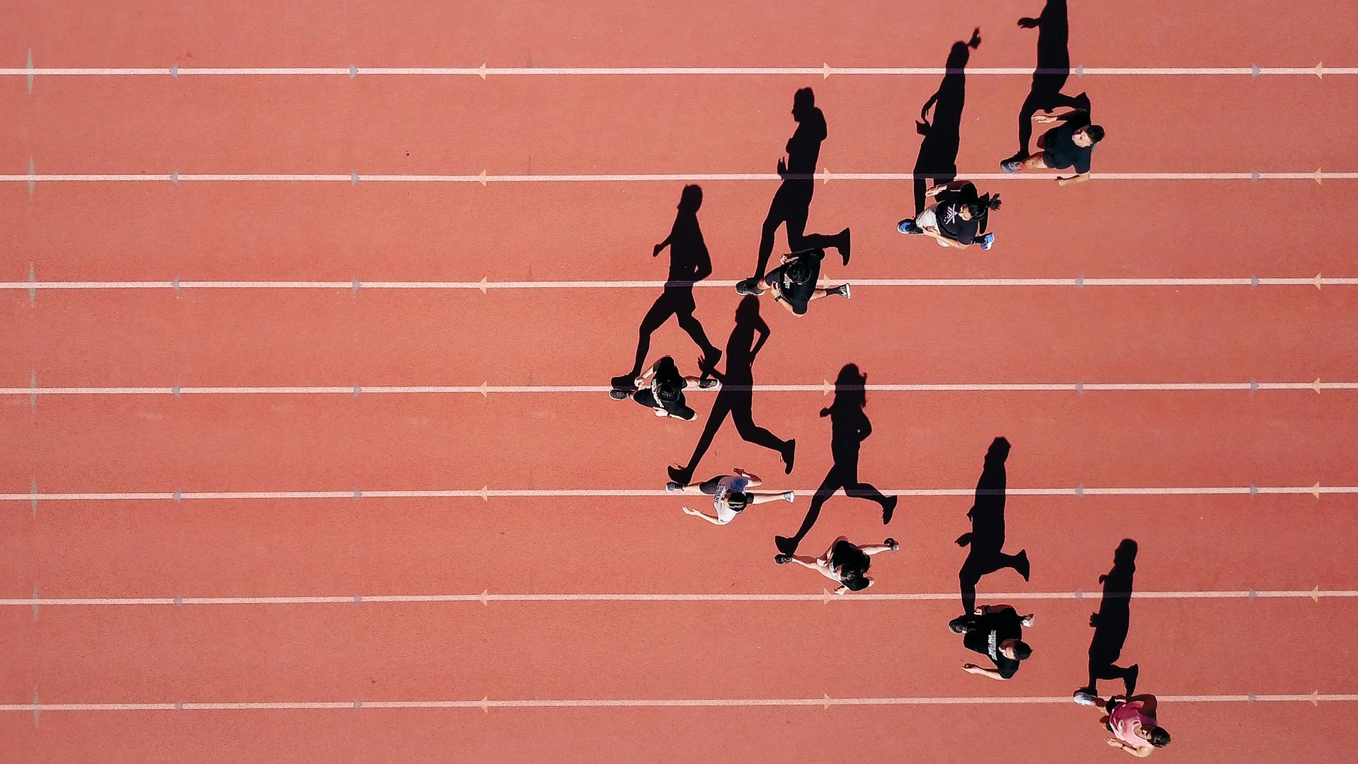 group of people running on stadium