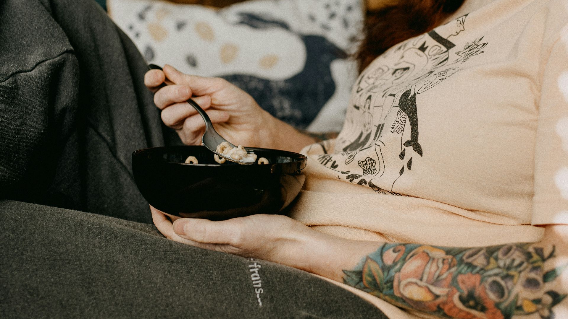 person holding black ceramic bowl