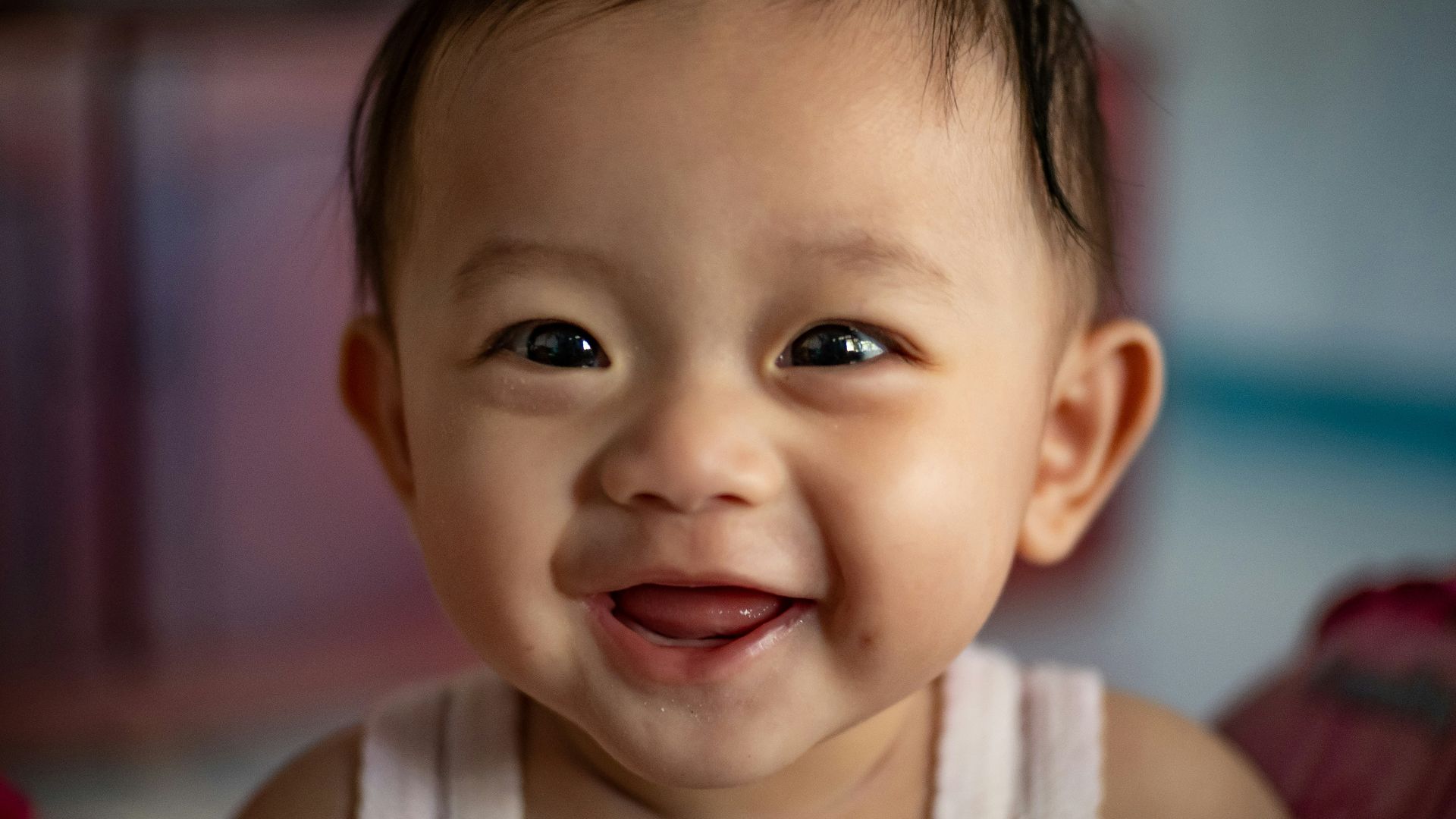 child in white tank top