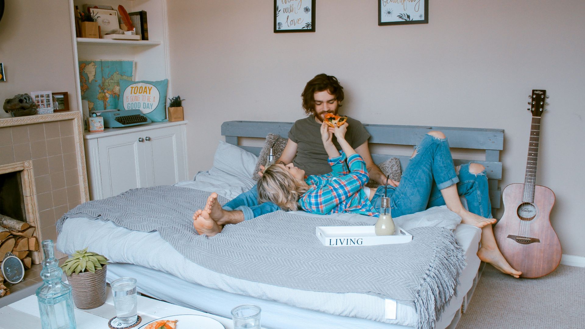 man and woman lying on bed