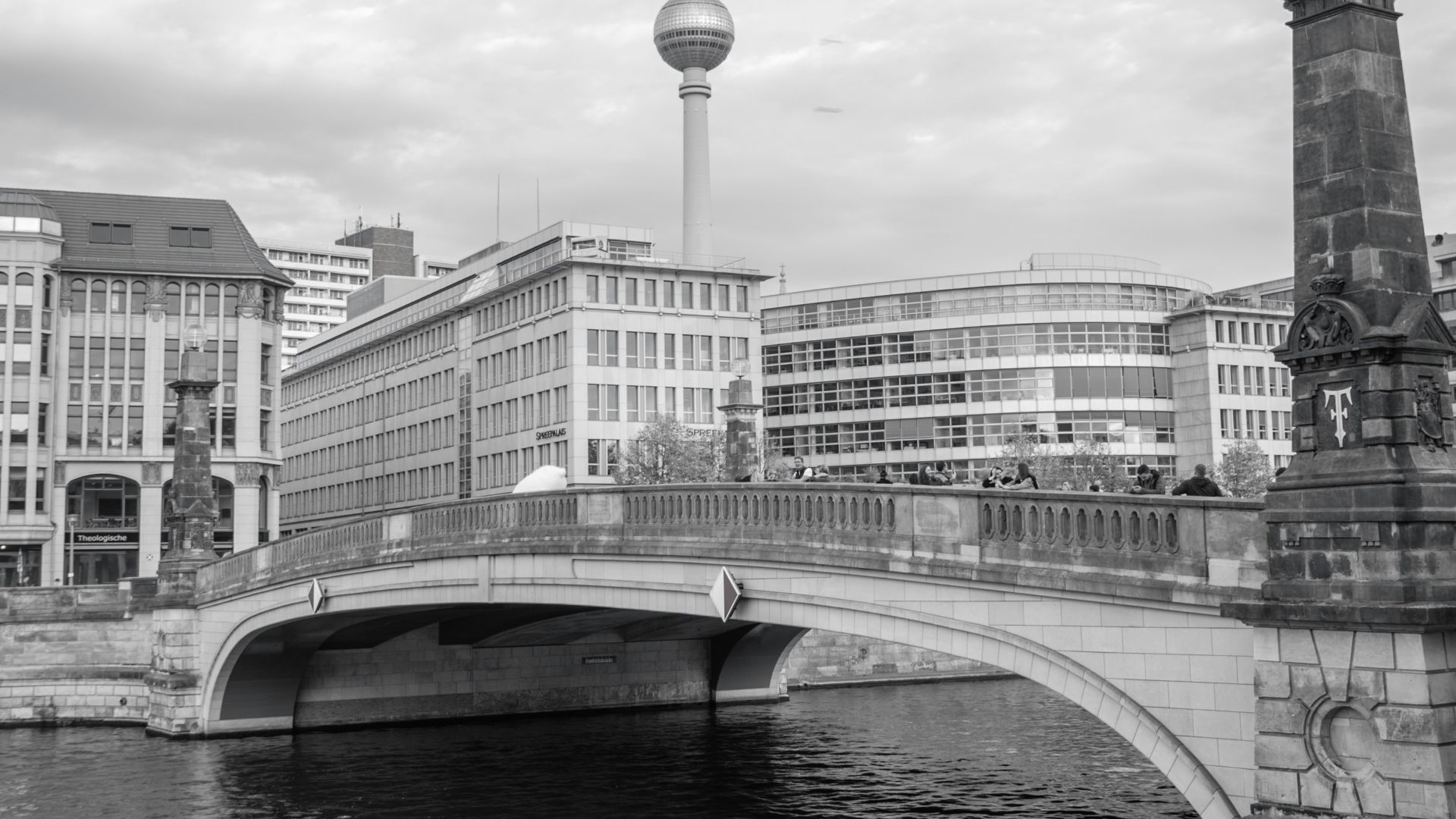 a bridge over a river with buildings on either side of it