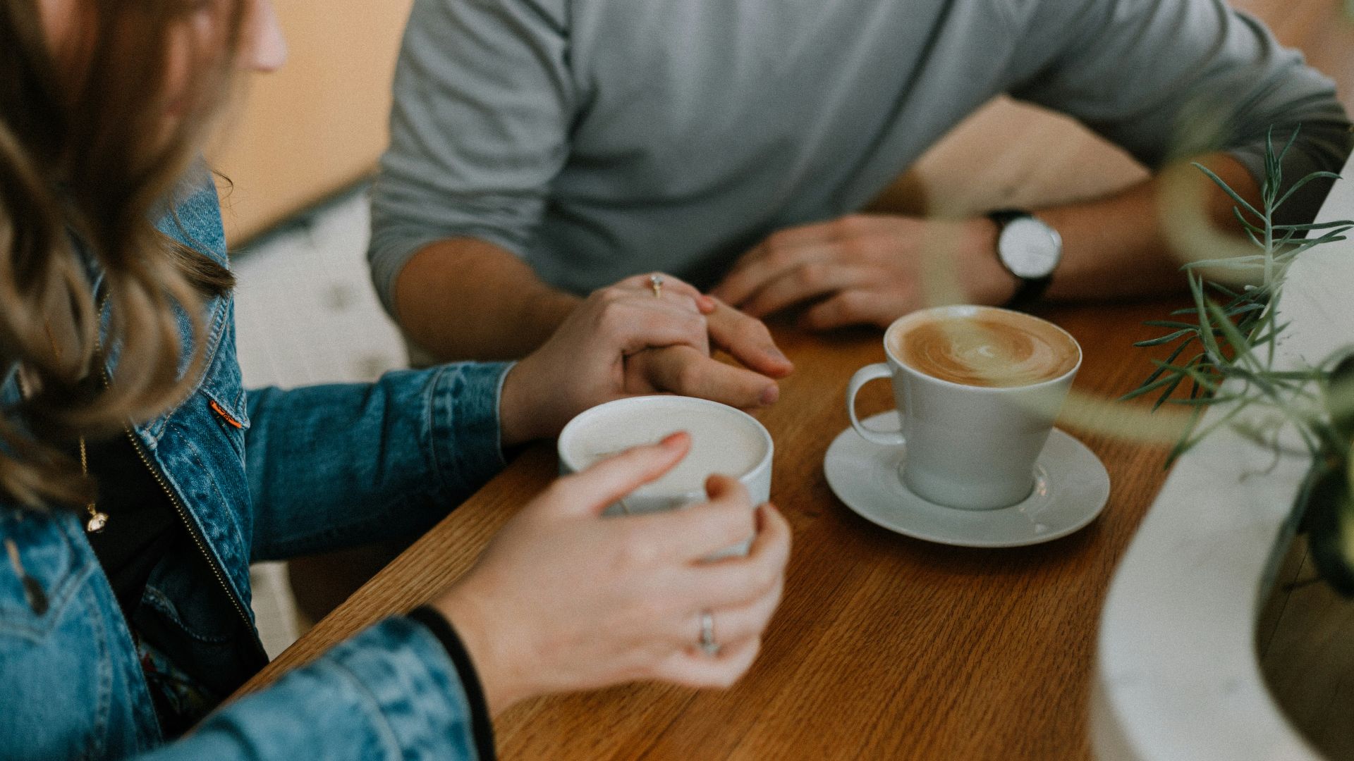 two mugs with coffee on table