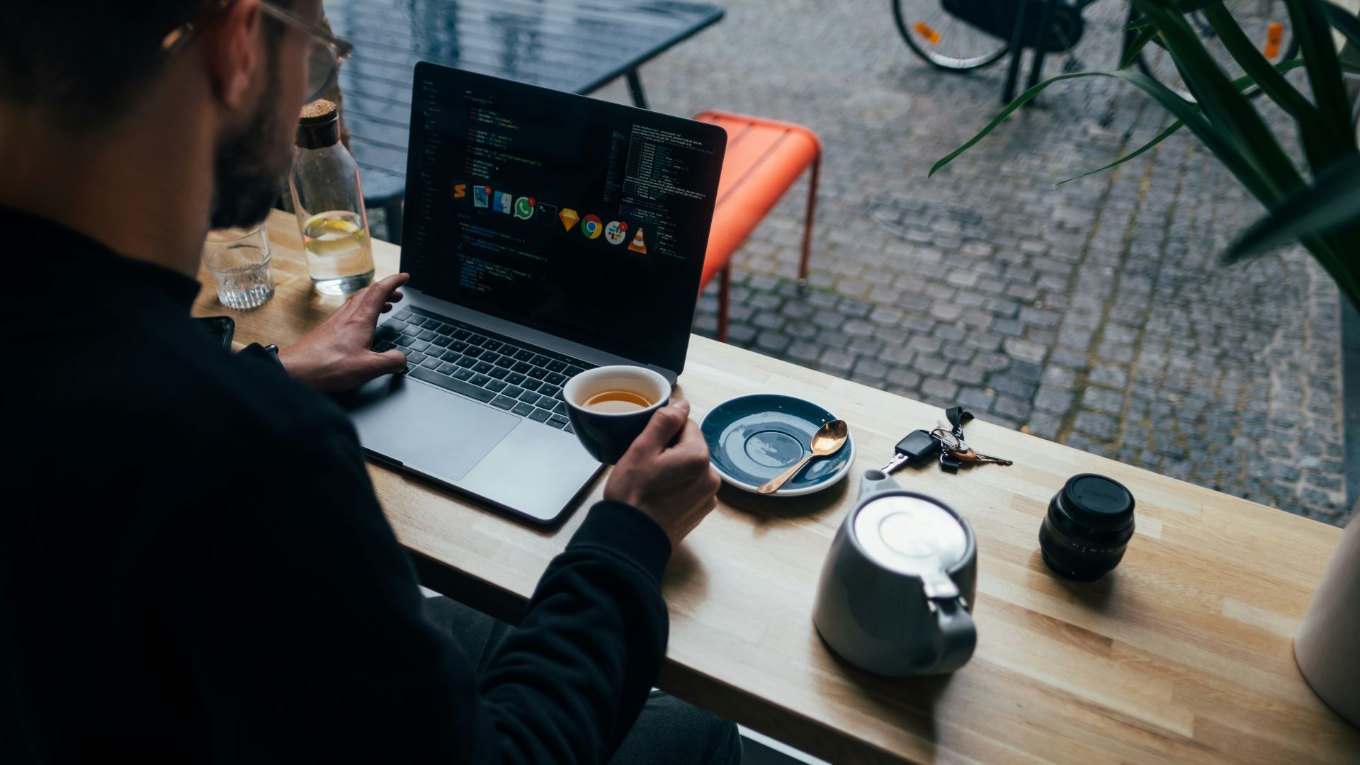 man holding a cup with coffee
