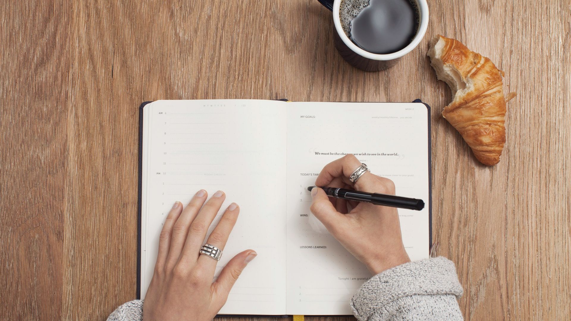 person writing on a book