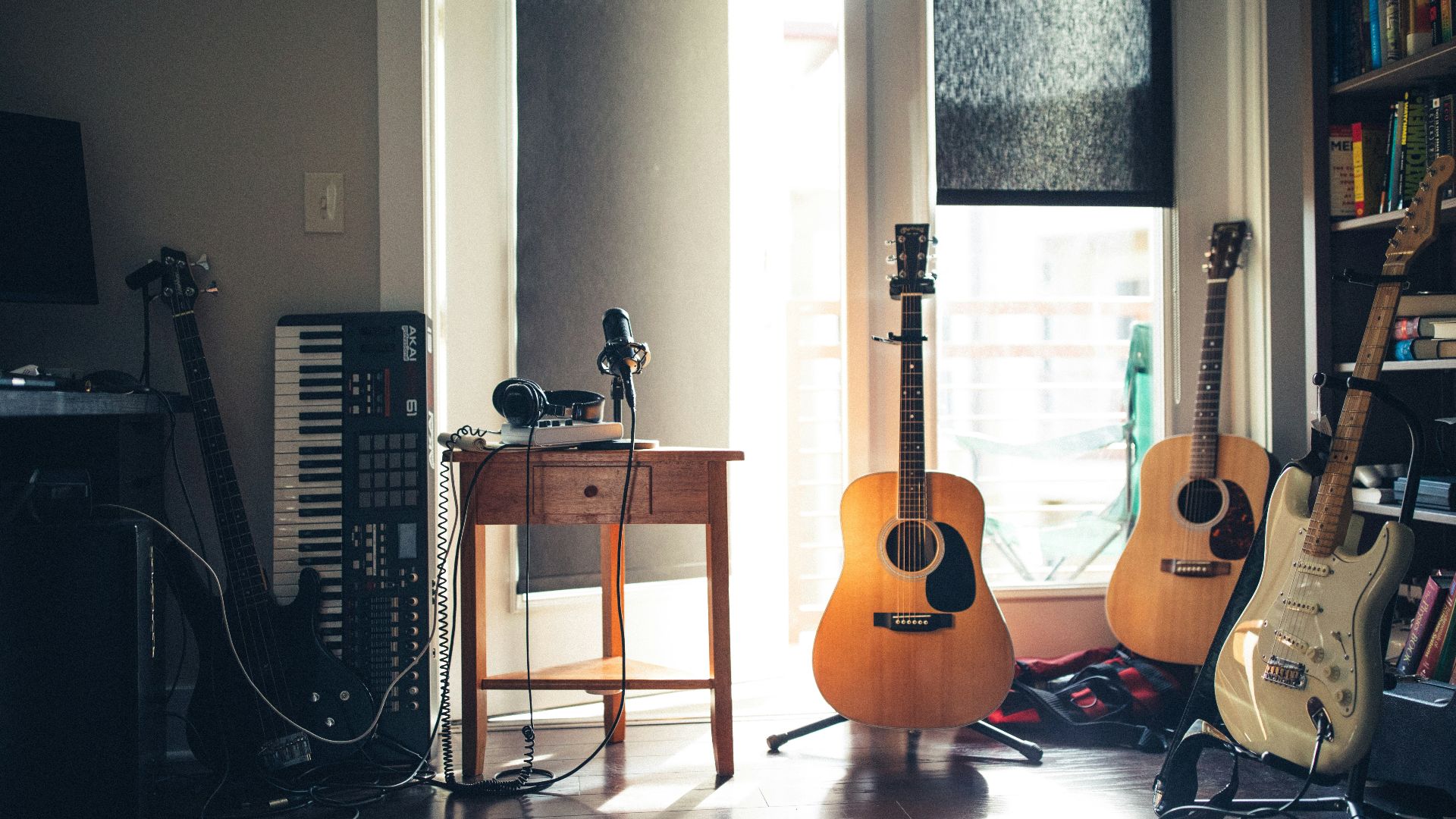 several guitars beside of side table