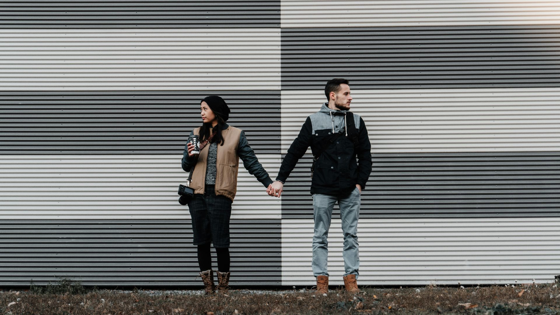 man and woman holding each other's hands