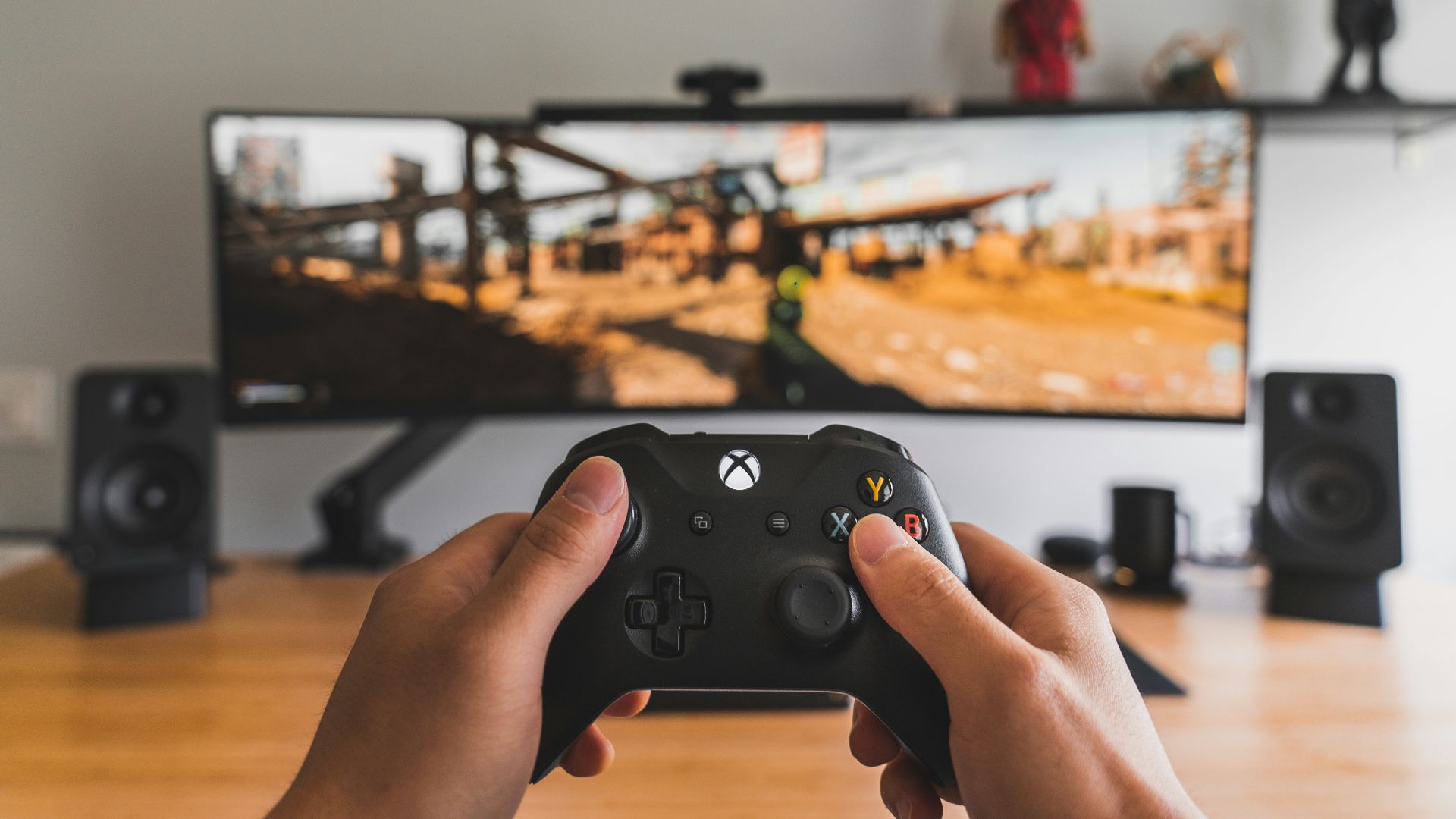 person holding black game controller