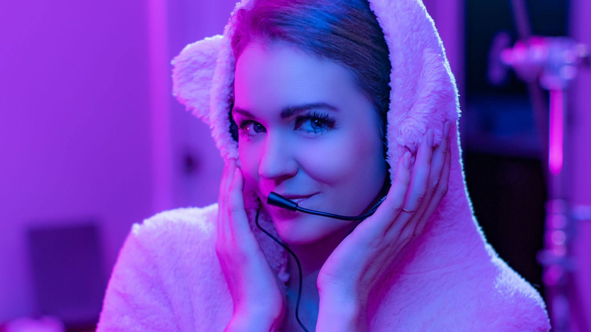 woman in white bathrobe covering her face with white towel