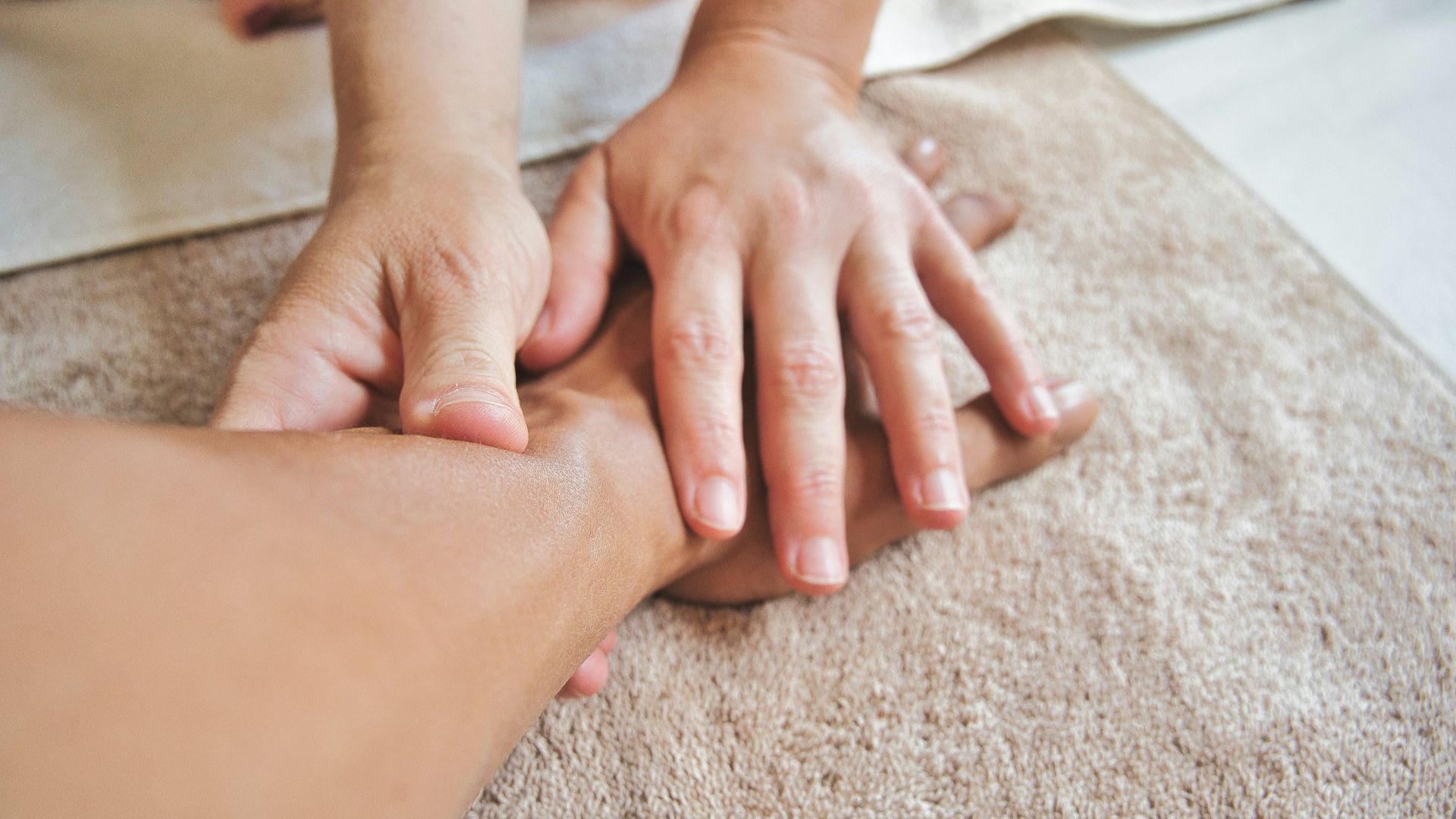 persons hand on persons lap