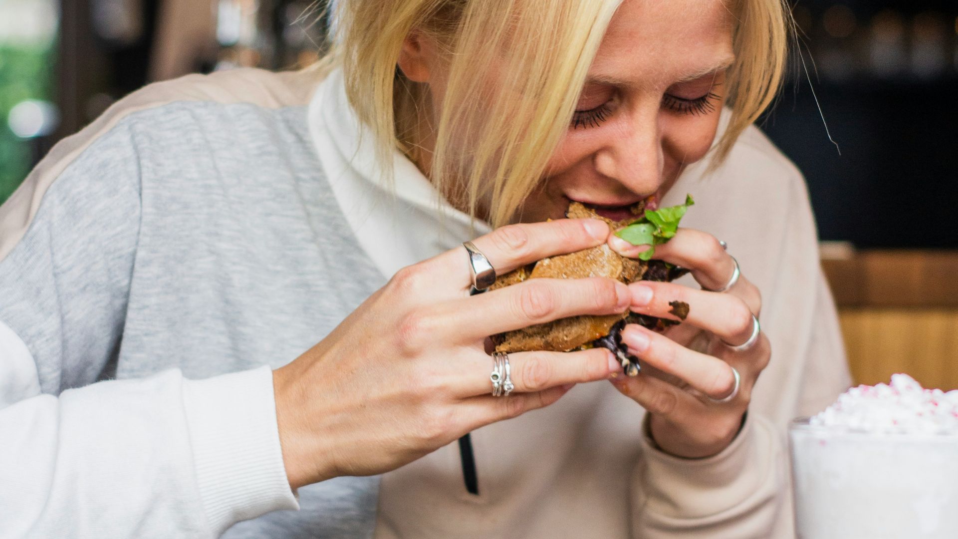 woman eating burger