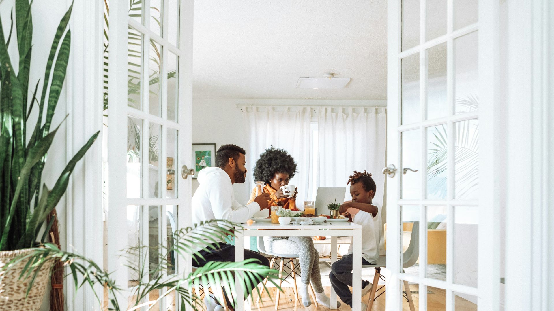 people sitting on chairs in front of table