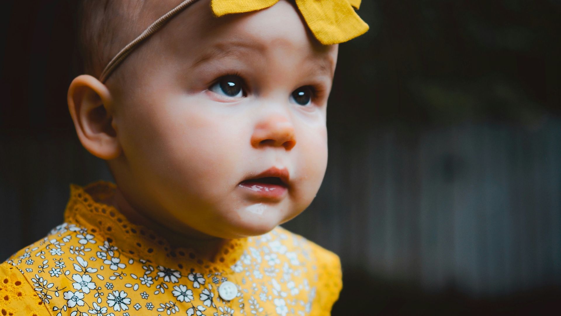 baby in yellow dress