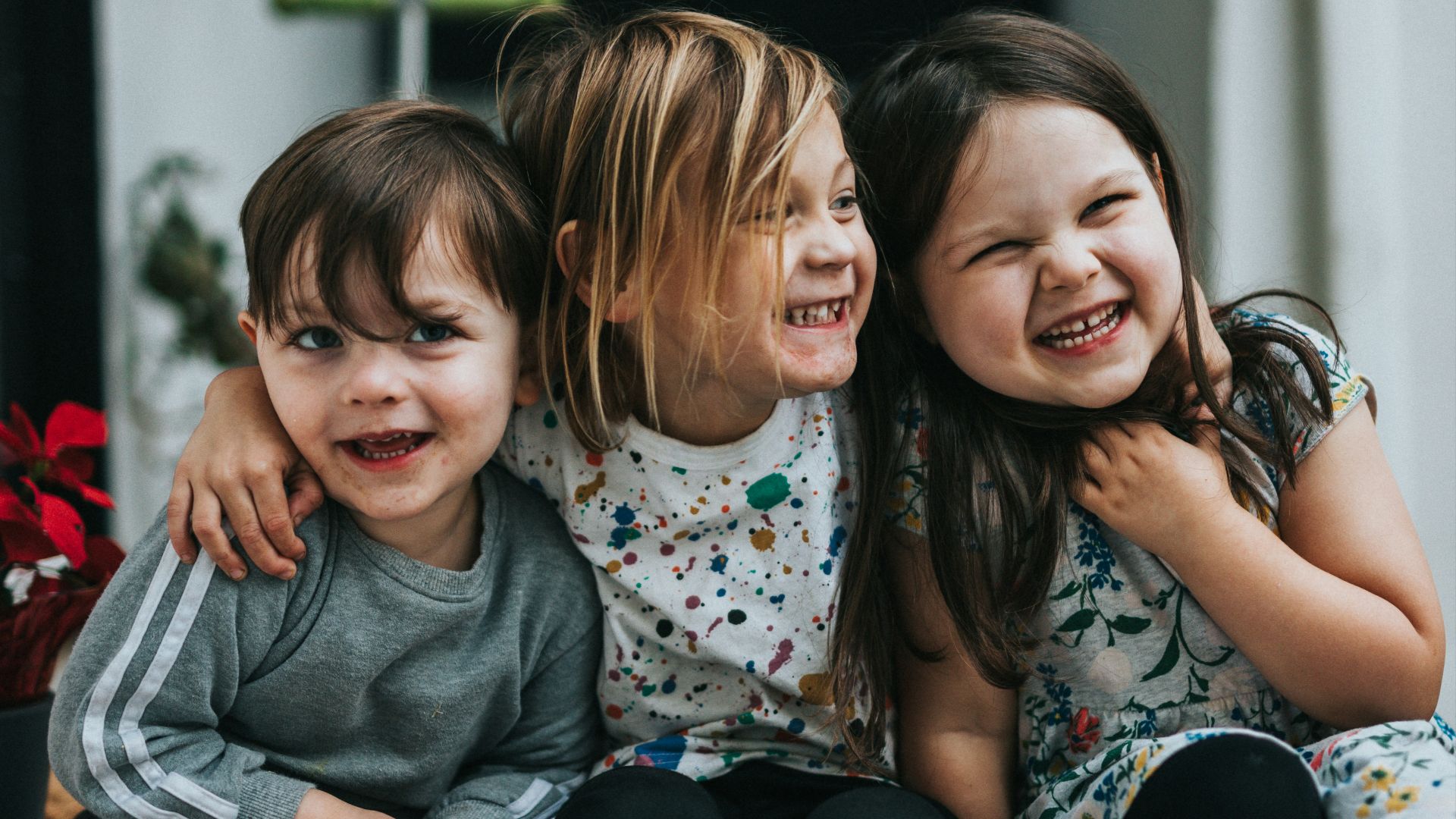 2 girls sitting on floor