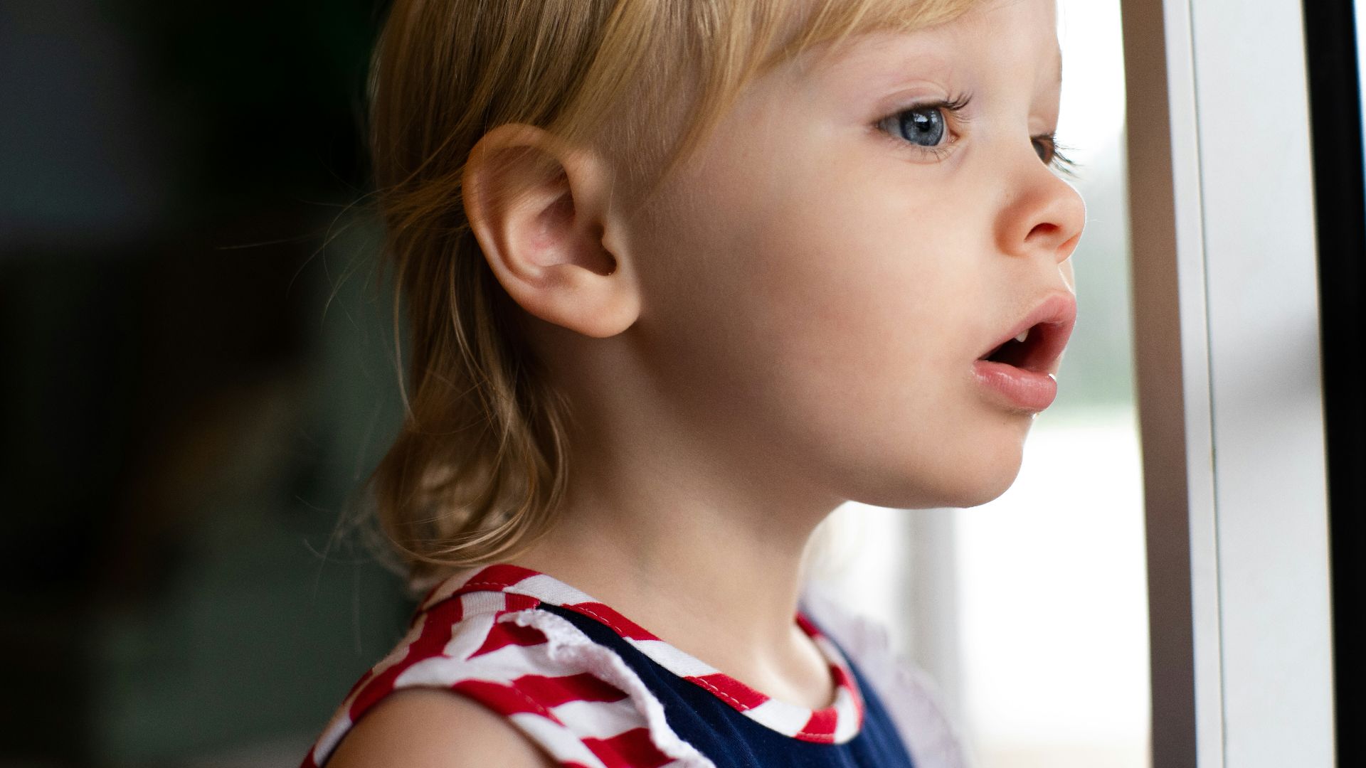 girl in blue and white tank top