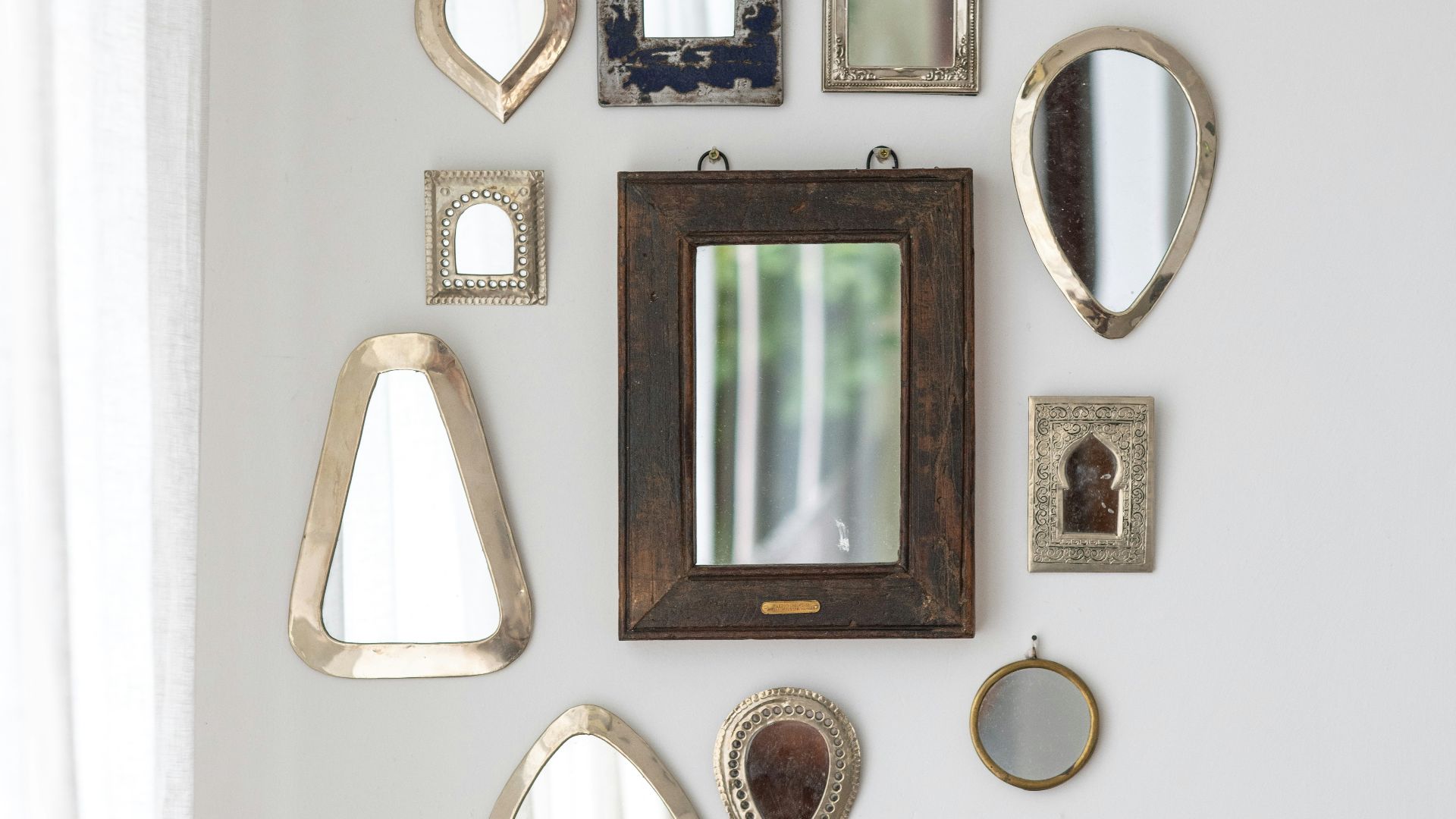 black framed wall mounted mirror